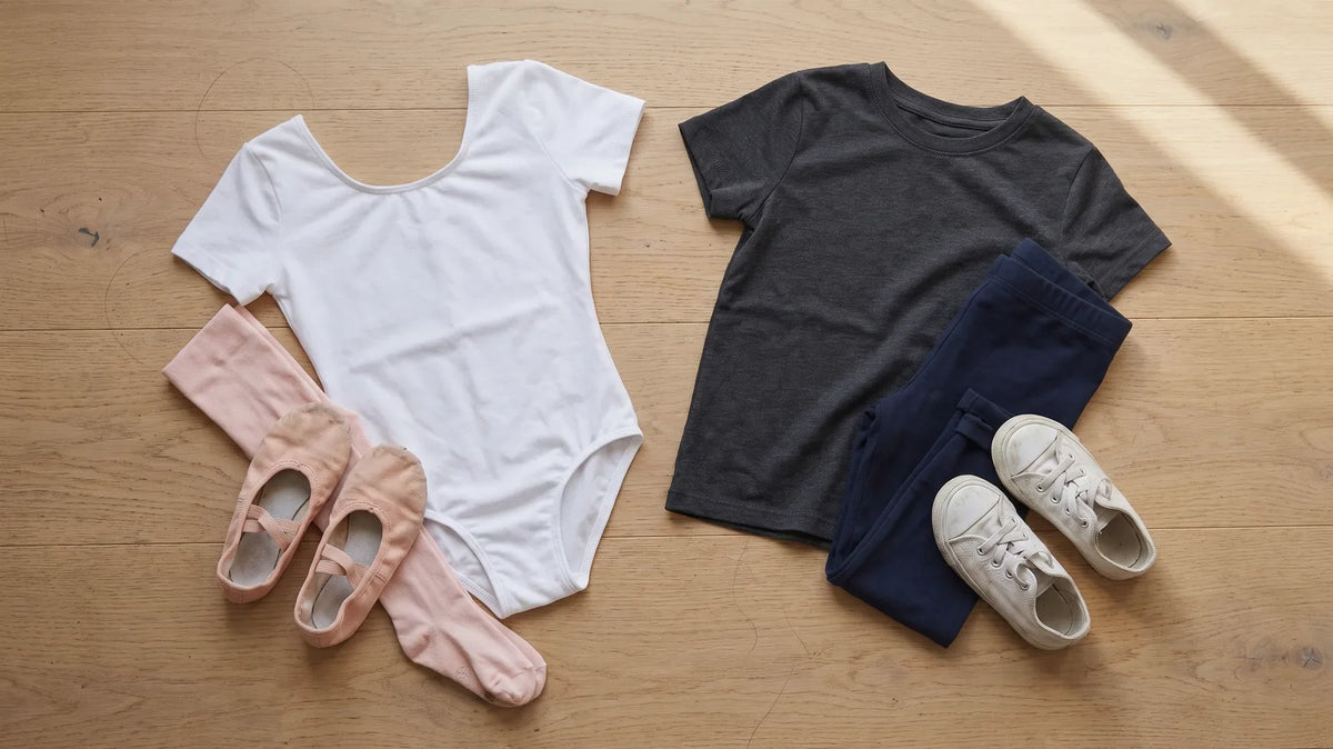 Two girls' dance outfits laid out flat side by side: ballet leotard set and hip hop set