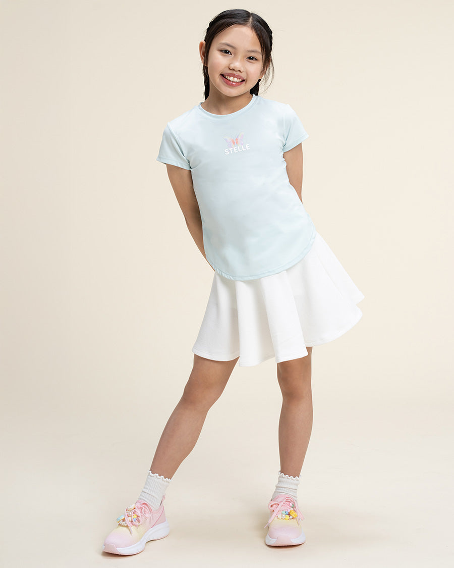 A Girl wearing Mint Green T-Shirt & White Skort