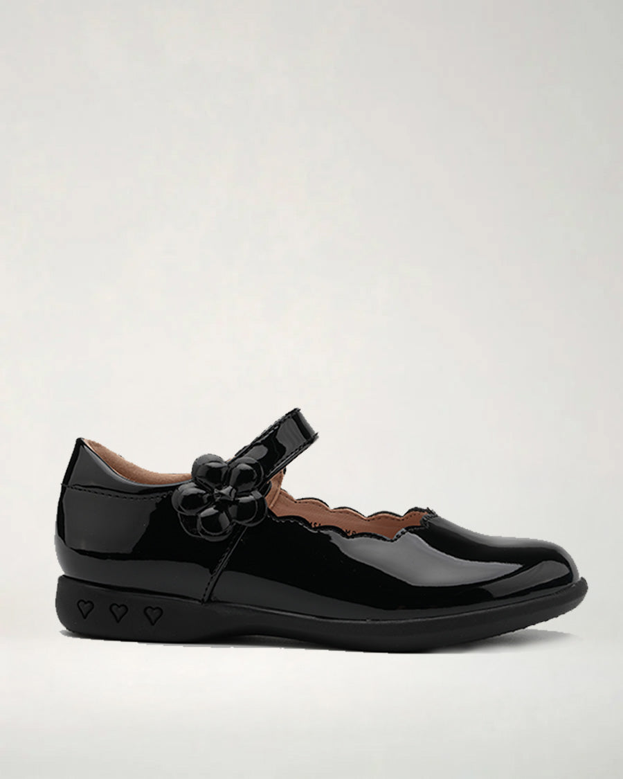 A black Mary Jane style girls' dress flat with decorative accents on the strap and a round toe.