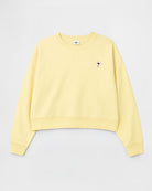 Yellow sweatshirt with a small logo on a light gray background