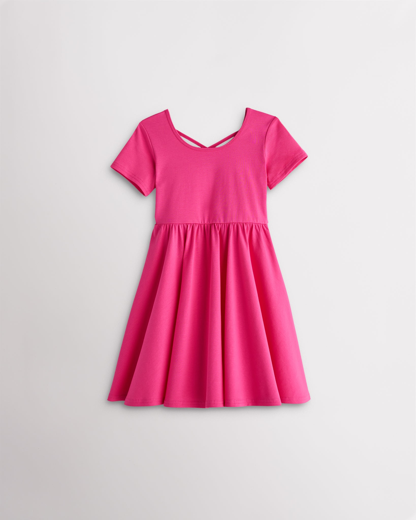 Girls dreamhouse pink short sleeve A-line twirly dress with a flared skirt.