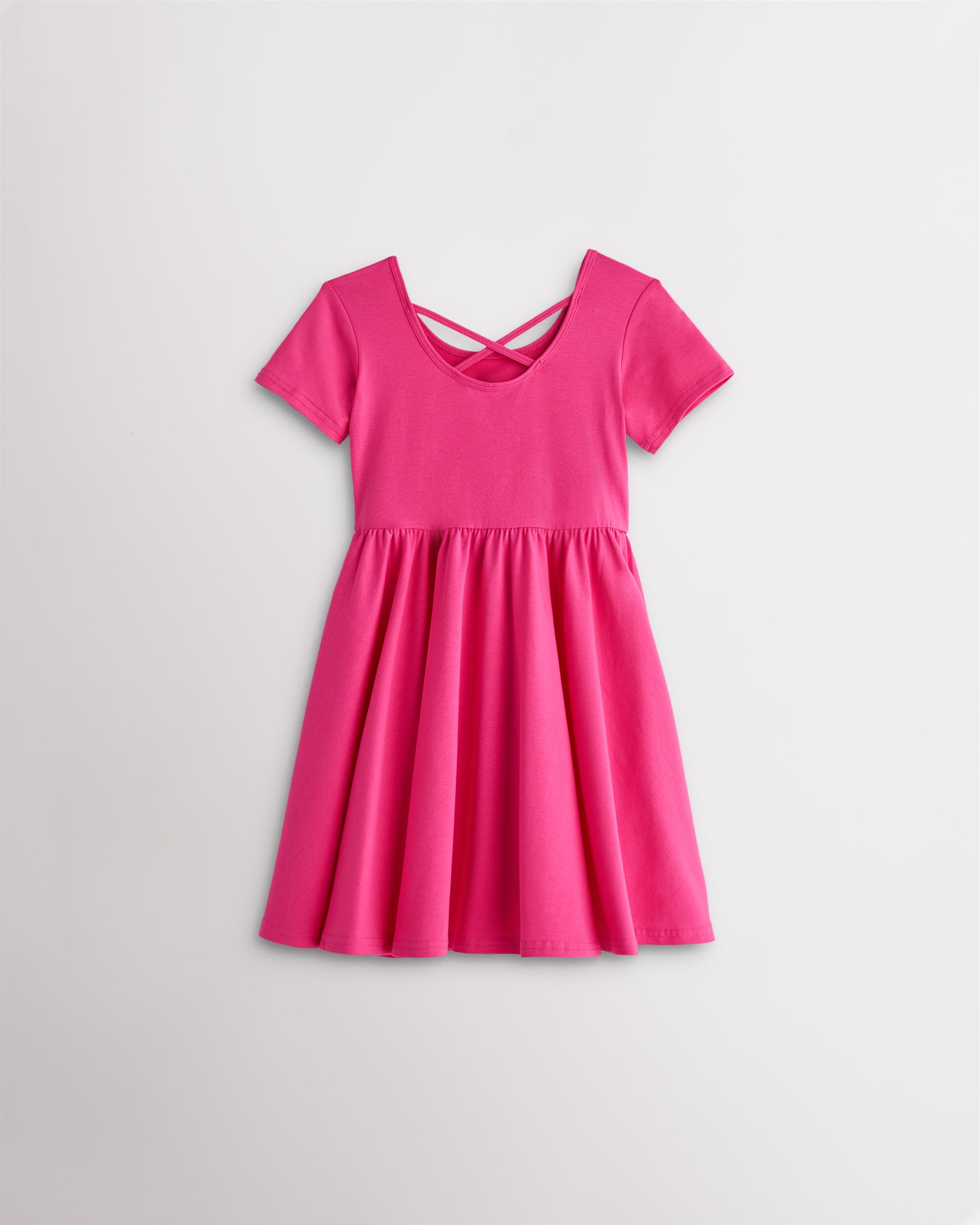 Girls dreamhouse pink short sleeve A-line twirly dress with a flared skirt.
