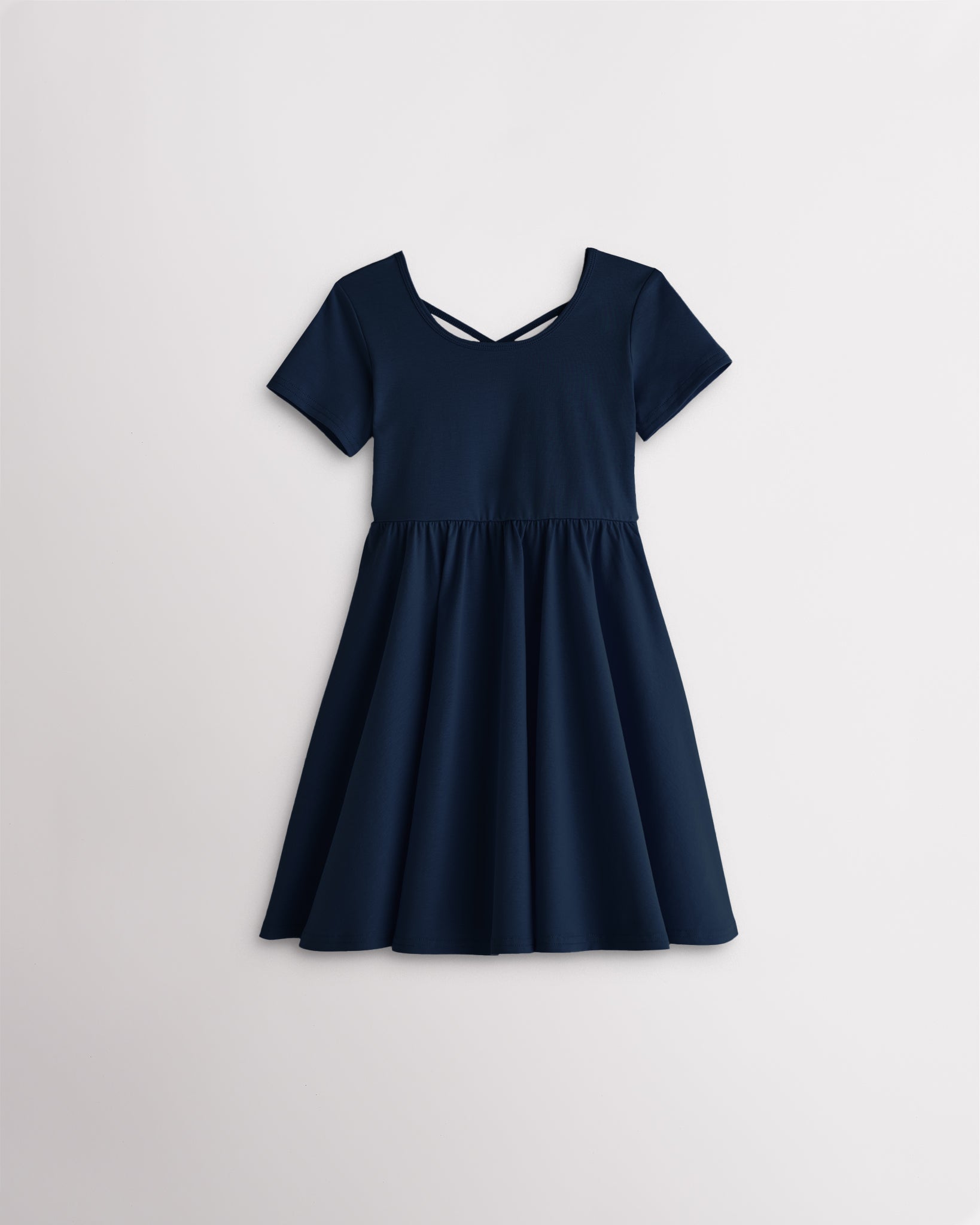 Girls navy short sleeve A-line twirly dress with a flared skirt.