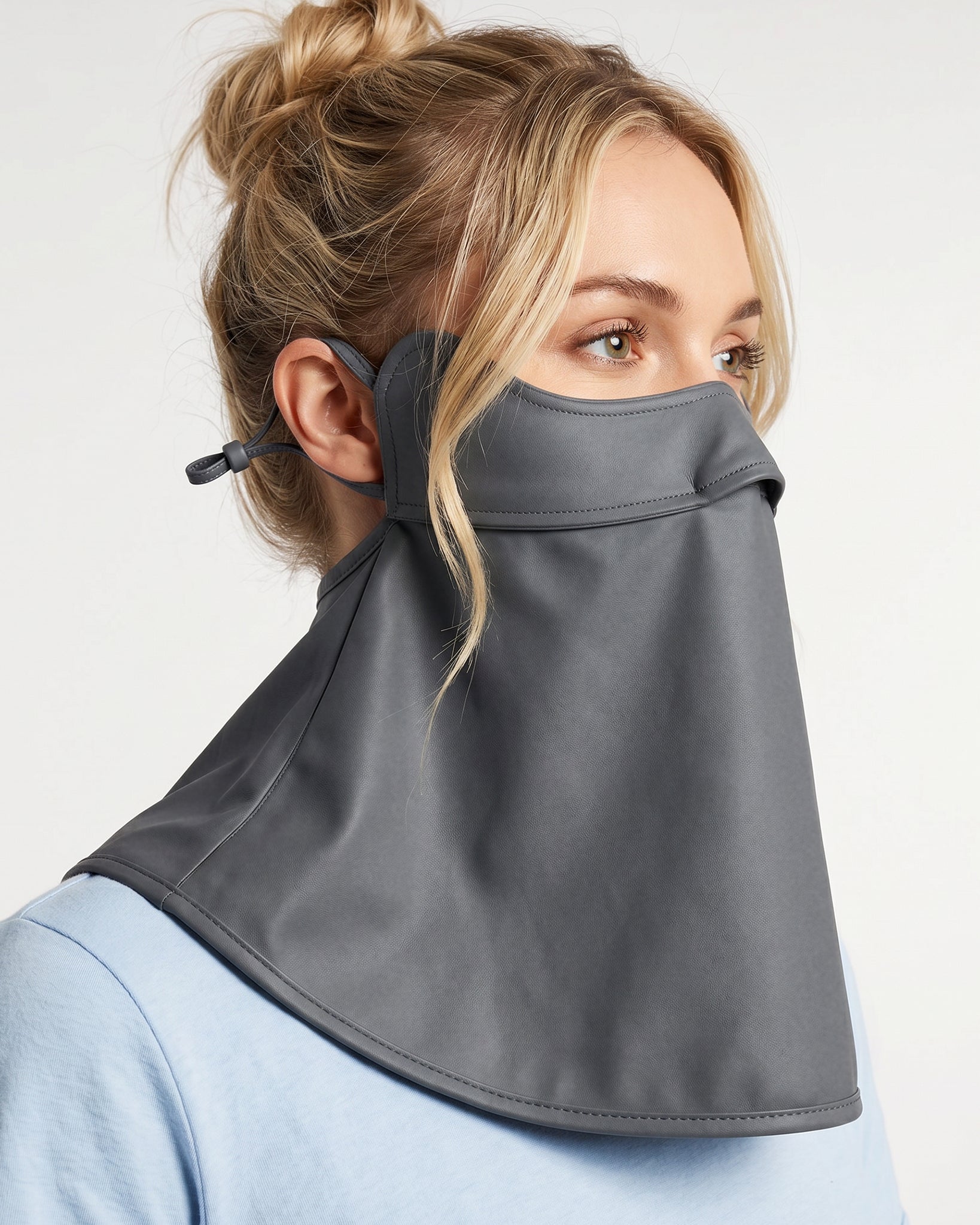Woman wearing a grey UPF 50+ sun protection face mask with full neck coverage, adjustable ear loops, and secure back fit.