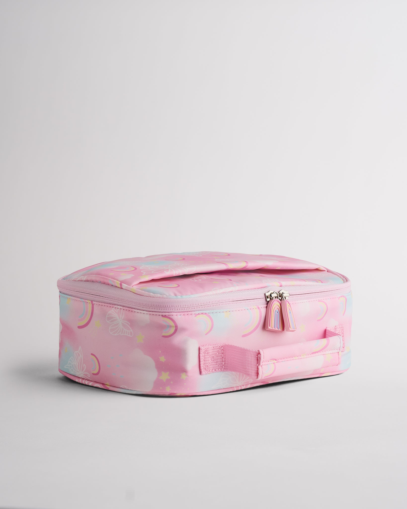 Side view of pink Stelle lunch bag with rainbow zipper pulls, soft-sided shape, and easy-carry handle.