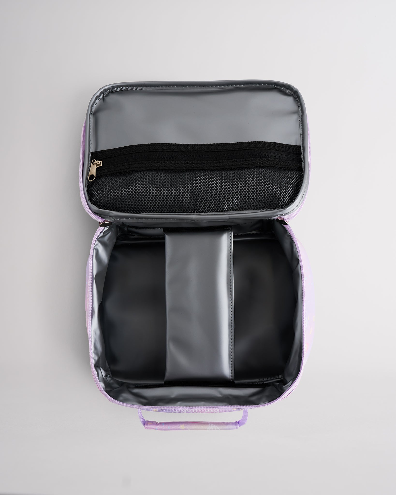 Open Stelle kids lunch bag showing insulated interior, zipper mesh pocket, and roomy storage for school meals.