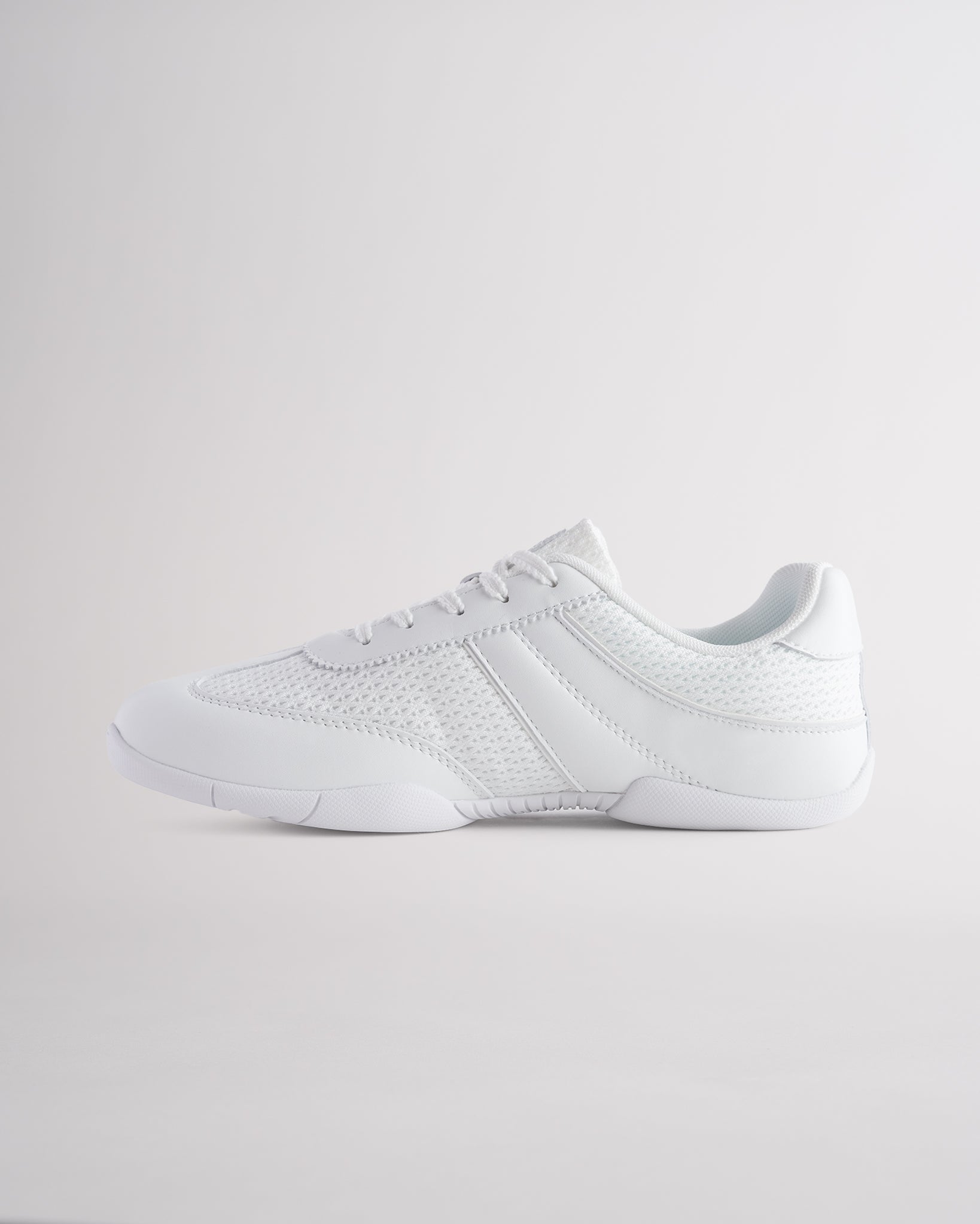 White Studio air mesh cheer shoes with lace-up closure.