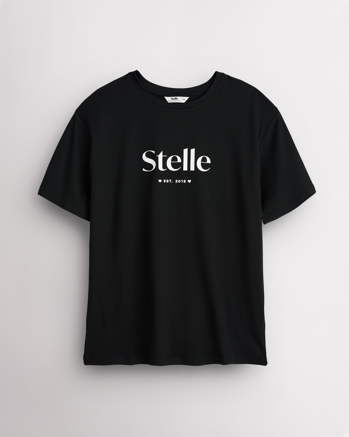 Black Stelle oversized T-shirt with a white Stelle logo on the chest, laid flat on a grey background.