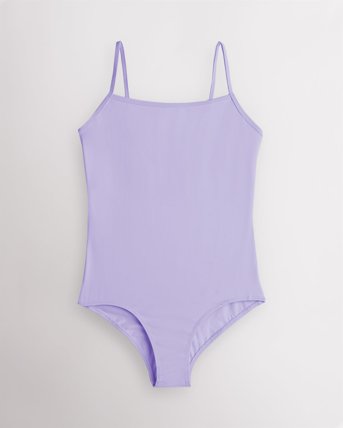 Lavender performance leotard for women with adjustable spaghetti straps, scoop neckline, supportive shelf lining, and a fitted silhouette for ballet and dance.