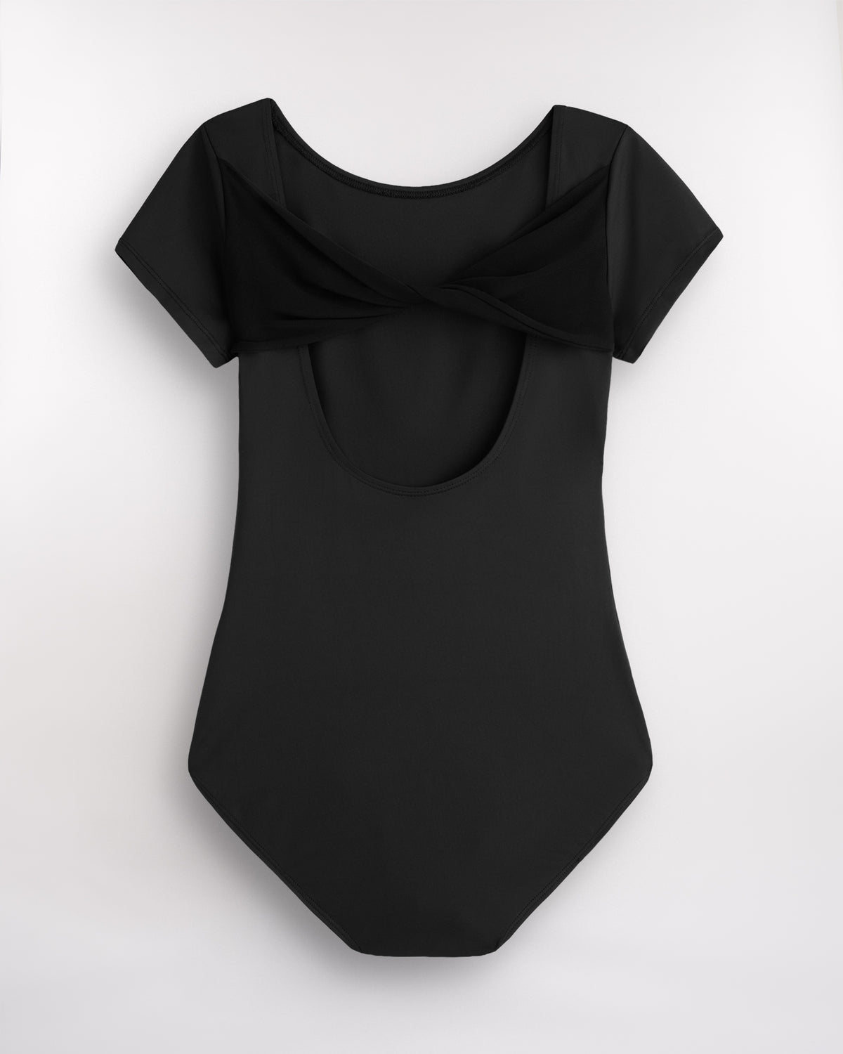 Back view of Black women’s dance leotard with twisted mesh detail and open-back silhouette.