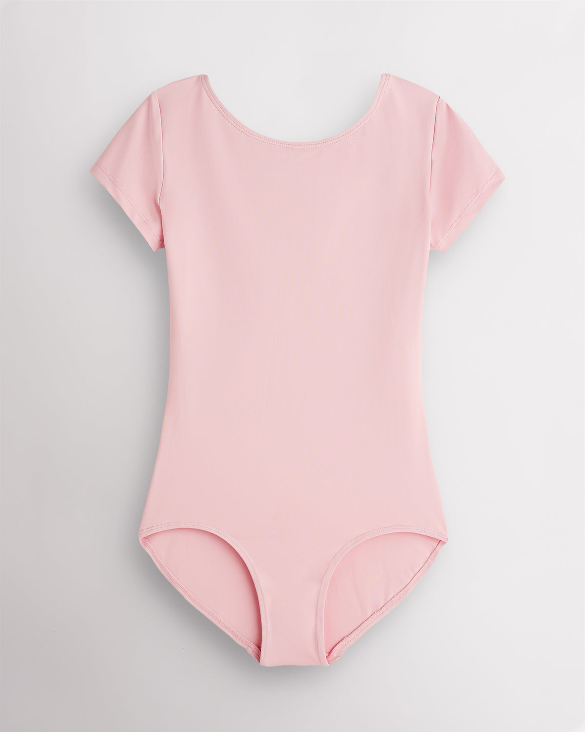 Ballet Pink short sleeve leotard for women with round neckline, fitted silhouette, and built-in shelf bra lining.