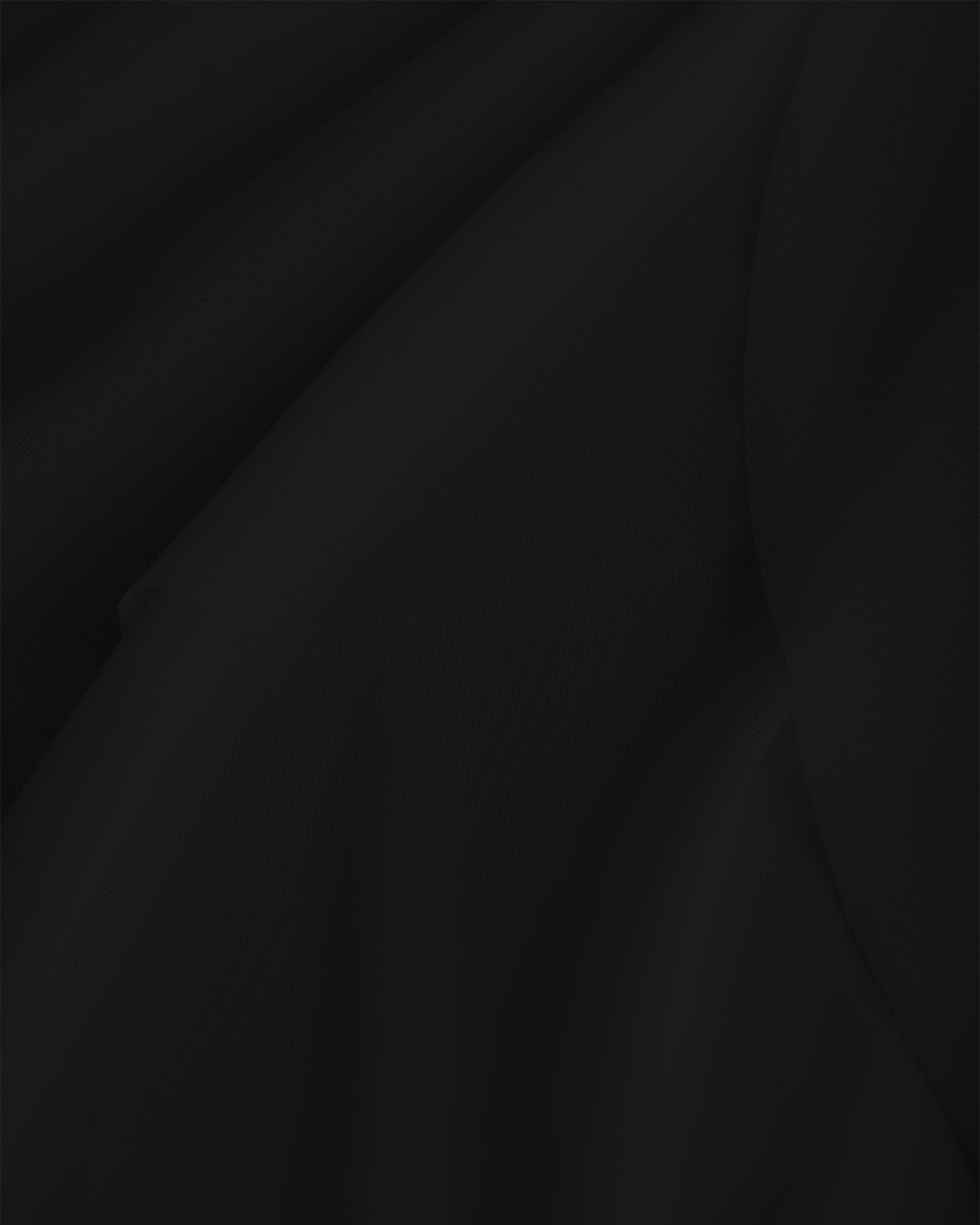 Close-up of black dance skirt showing soft mesh fabric and graceful drape