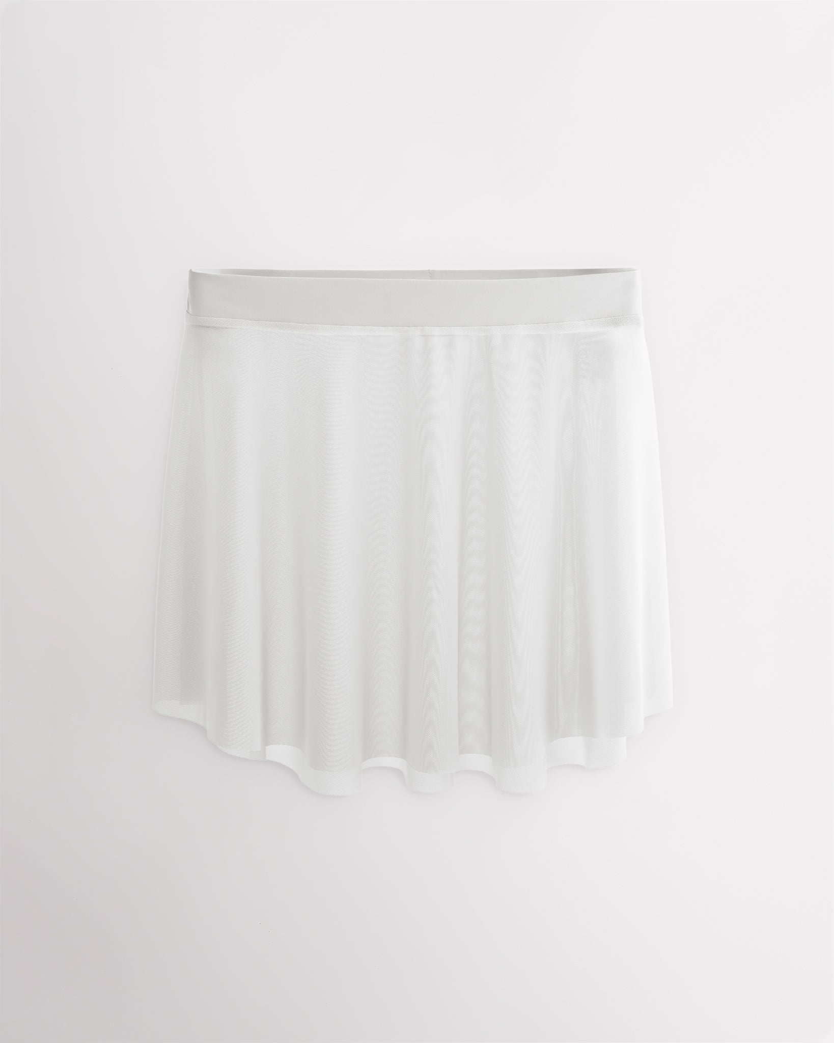 White Studio Mesh Dance Skirt with elastic pull-on waistband, elegant flared silhouette, and high-low hem for ballet and dance.