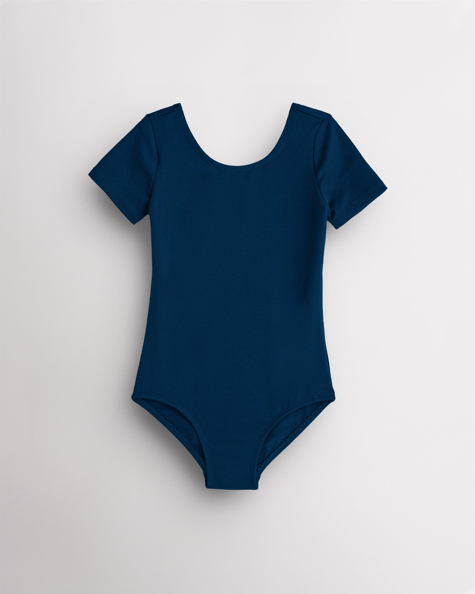 Navy leotard for girls with short sleeves, scoop neckline, and smooth performance fabric for ballet and dance.