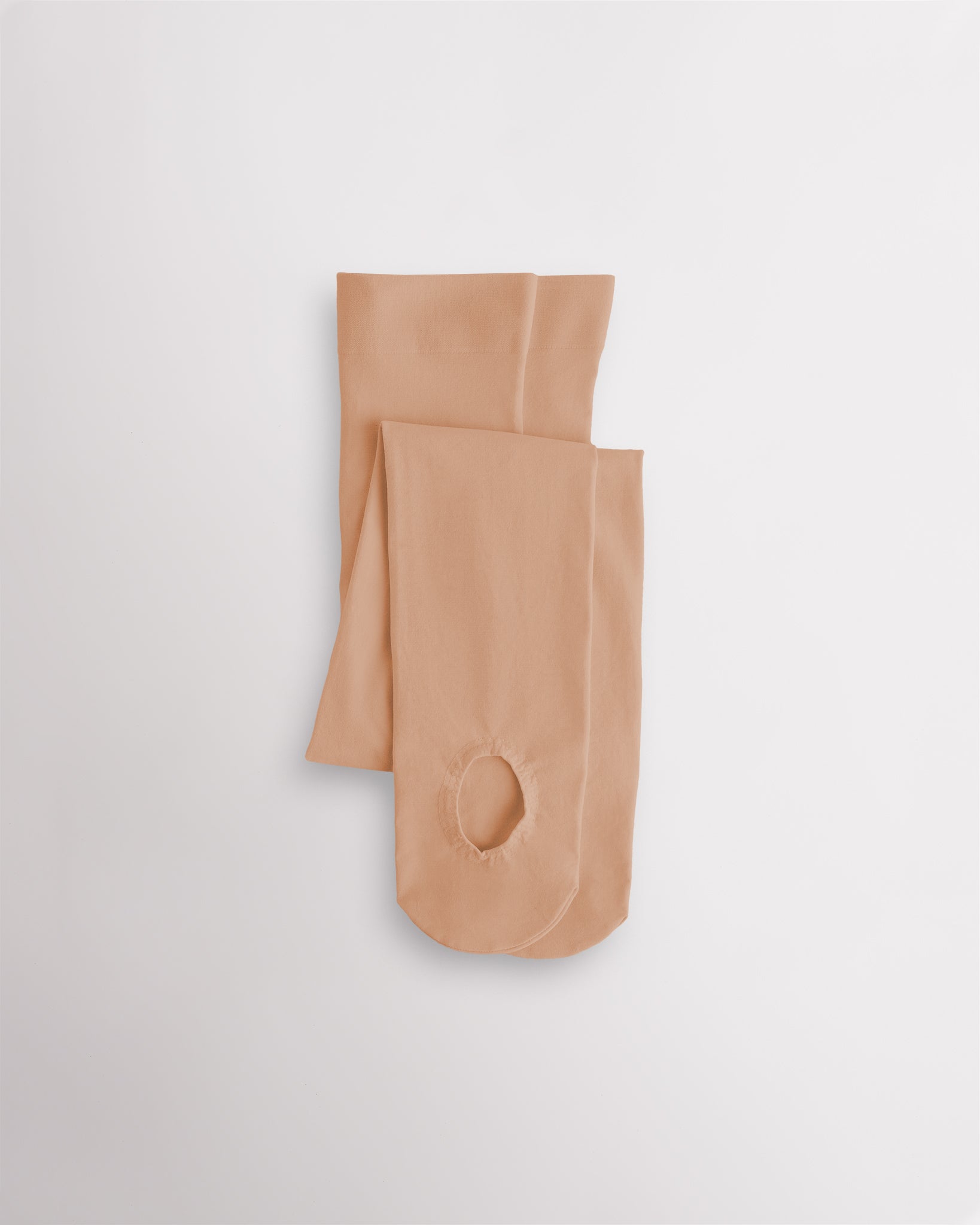 Tan convertible dance tights that can be worn as footed or footless tights for ballet and dance practice.