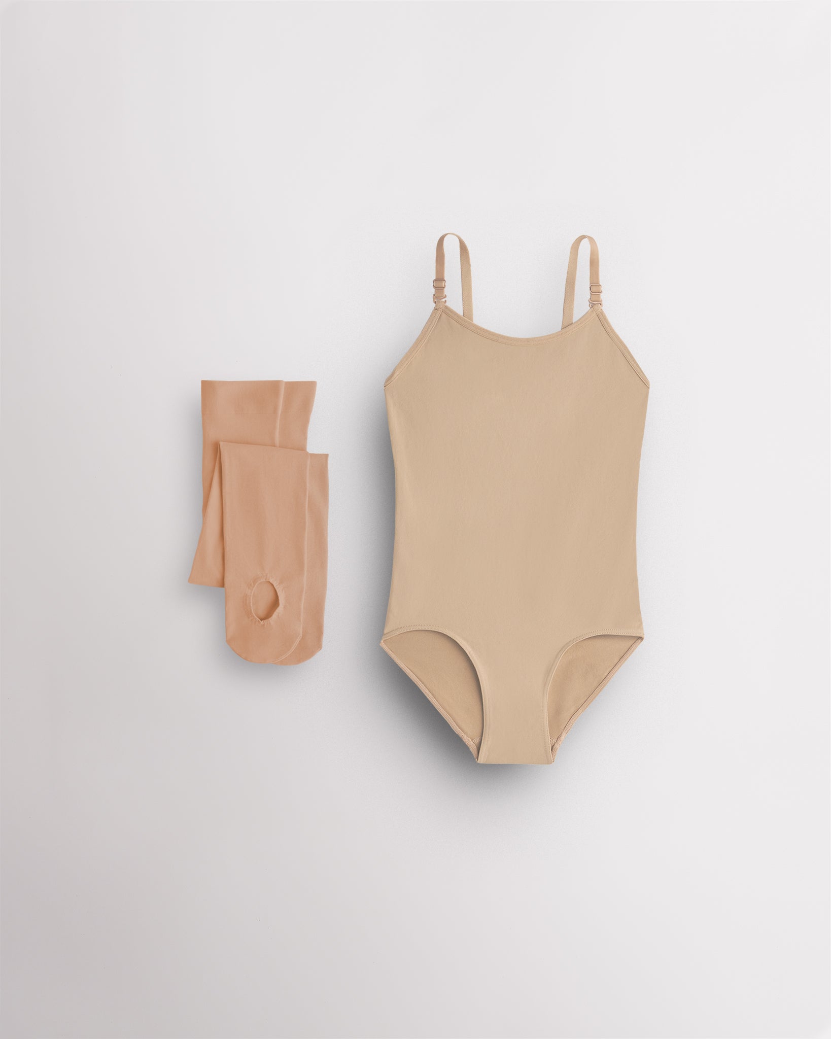 Rose Beige camisole leotard for girls with tan convertible tights laid flat for ballet, dance, and costume layering.