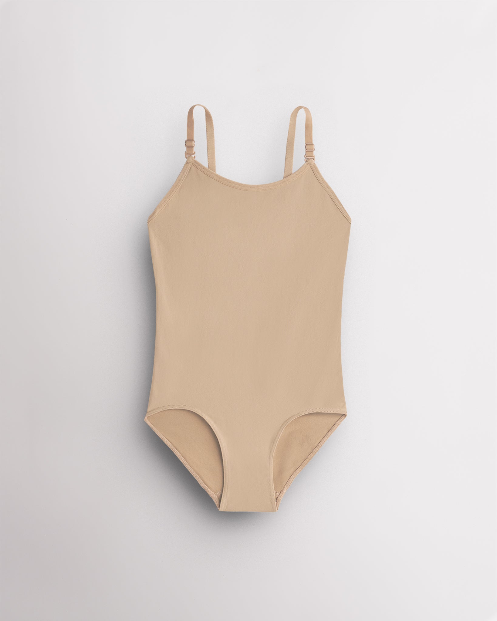 Rose Beige seamless camisole girls leotard with scoop neckline, adjustable straps, and smooth ballet base-layer design.