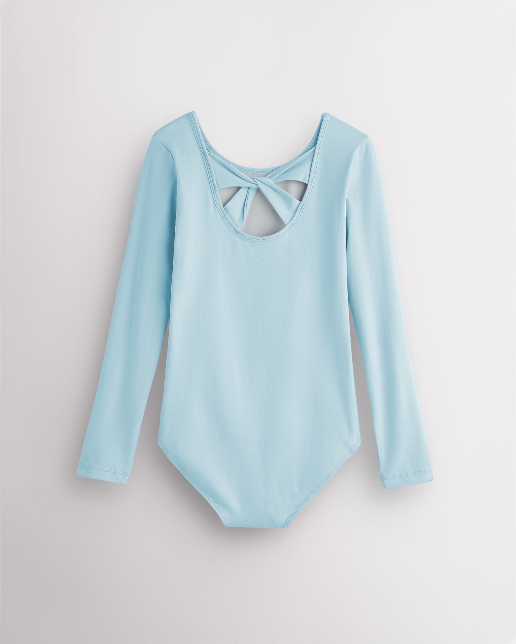 Back view of blue long sleeve leotard for girls with twist-back bow detail and soft cotton fabric.