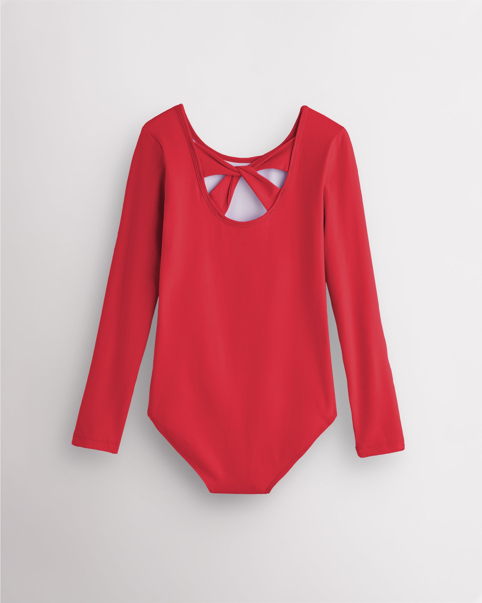 Back view of red long sleeve leotard for girls with twist-back bow detail and soft cotton fabric.