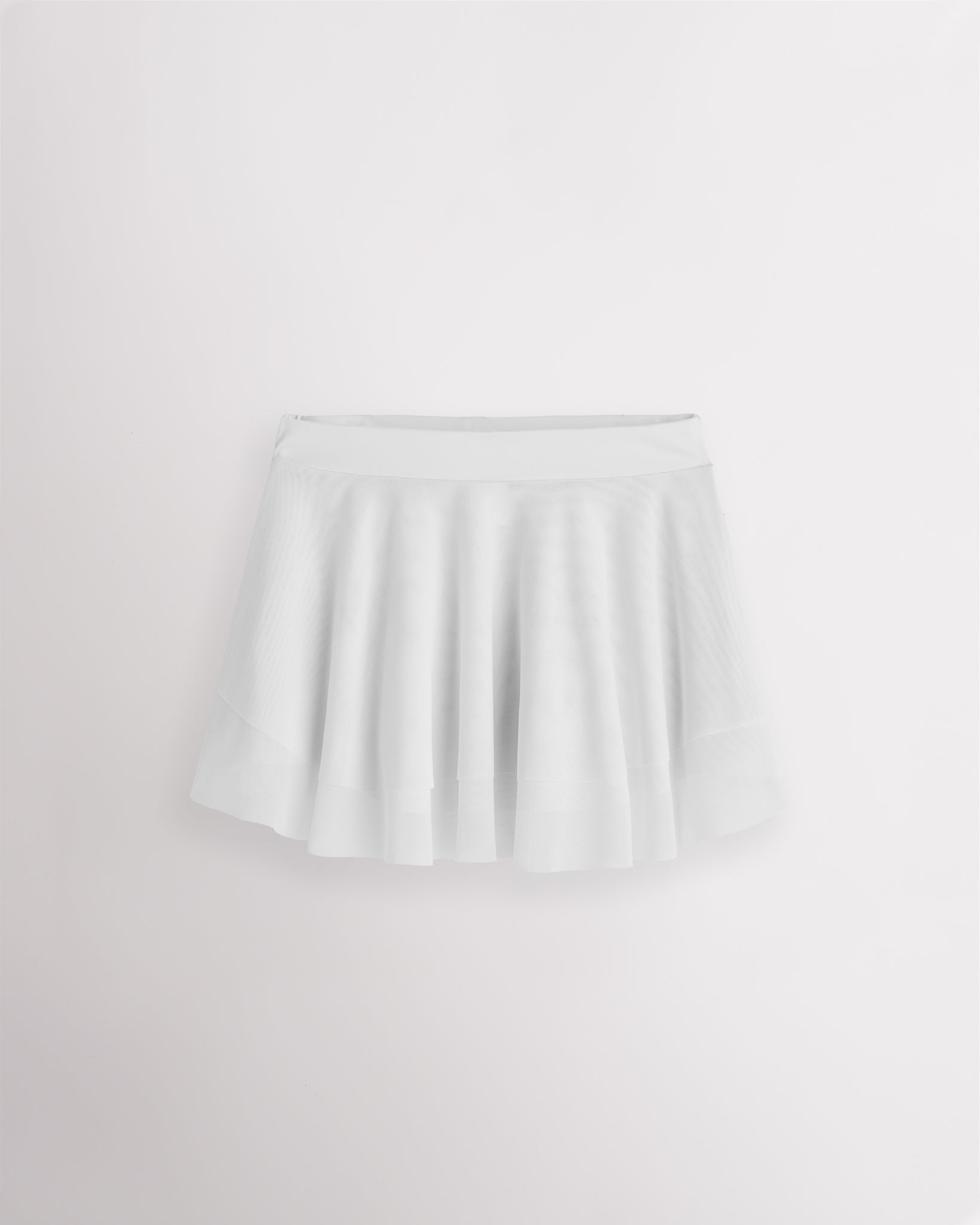 White Stelle girls ballet skirt with double-layer mesh, elastic waistband, and a softly curved flared hem.