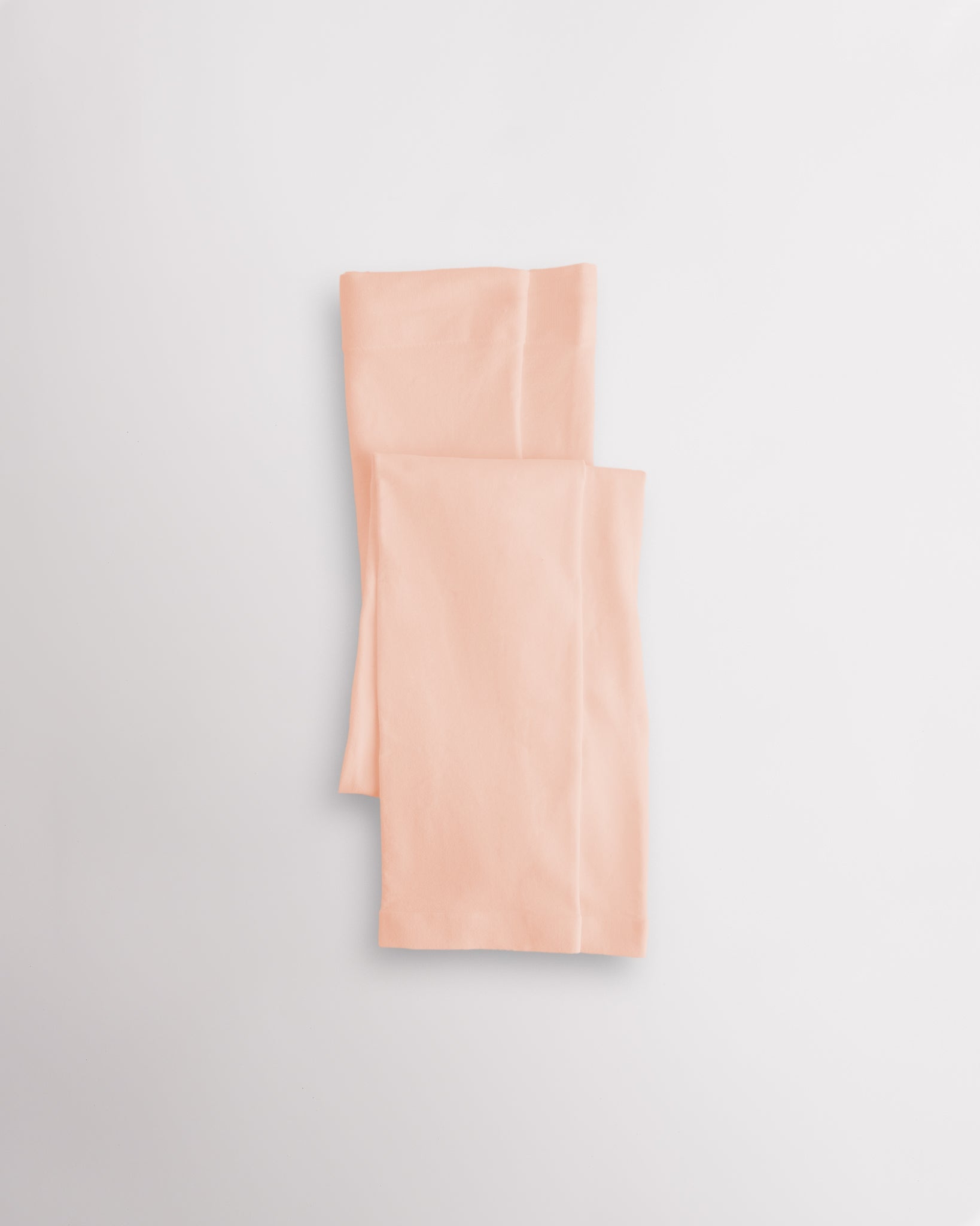 Ballet Pink girls microfiber footless dance tights folded flat with elastic waistband and soft fabric for ballet and dance practice.