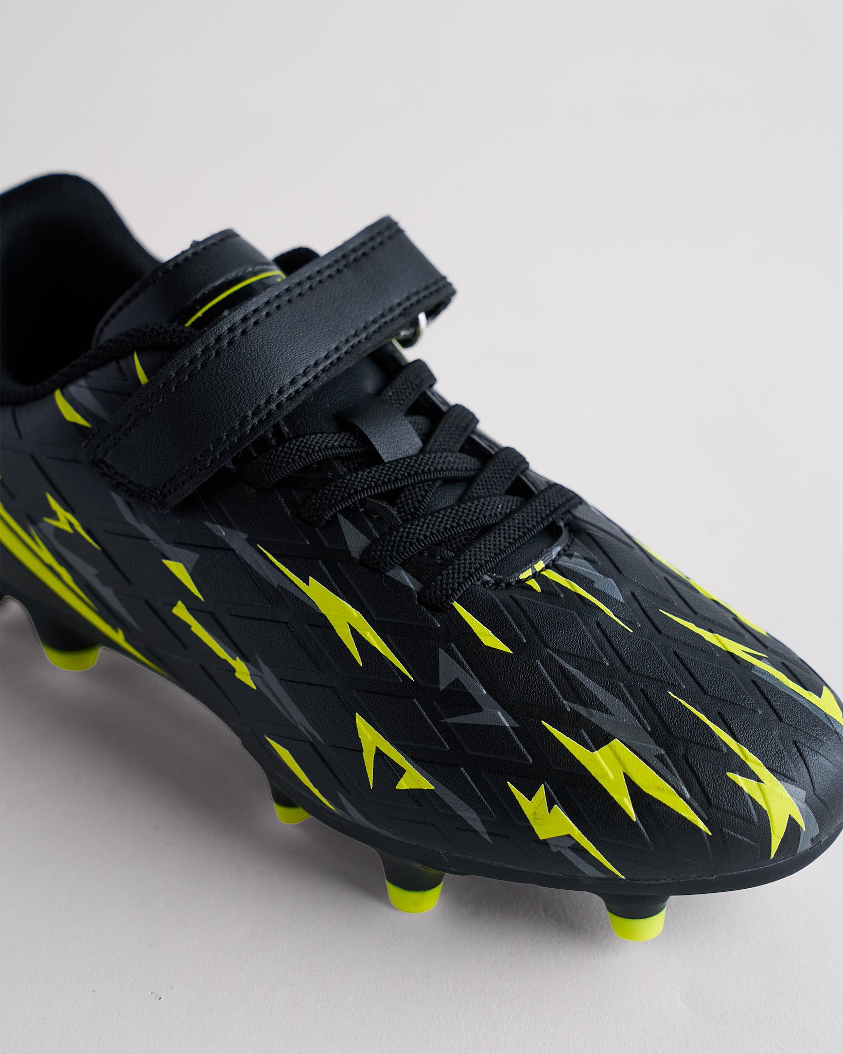 In A Flash Kids Soccer Cleats in Black Bolt
