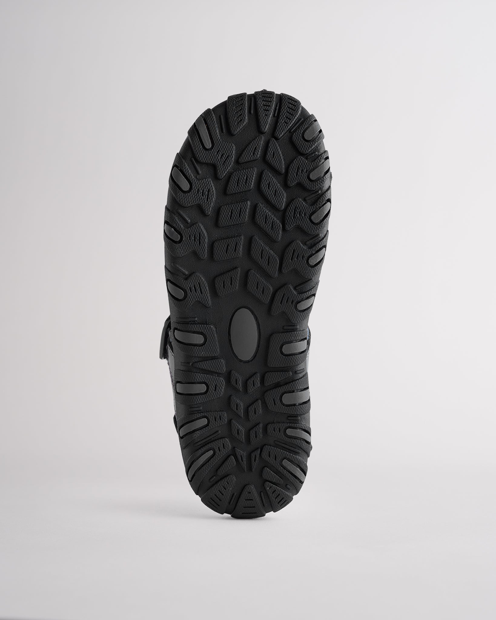 High-traction rubber outsole on kids sandal designed for grip and durability