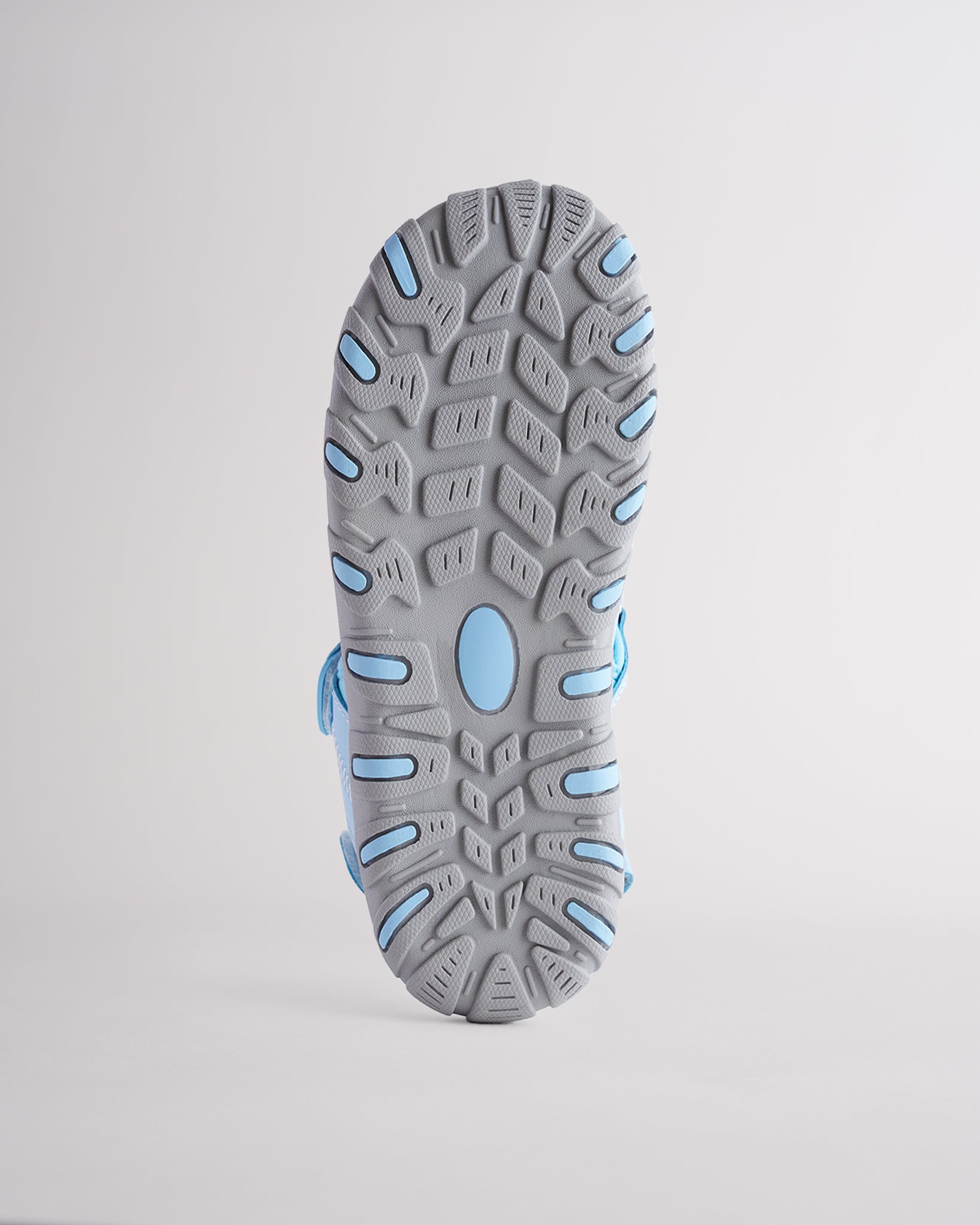 High-traction rubber outsole on kids sandal designed for grip and durability