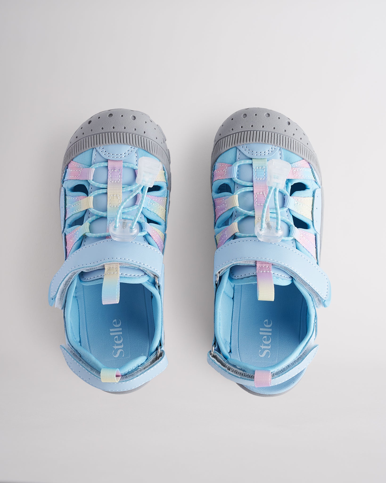 Top view of kids sandals with cord lace system and adjustable hook-and-loop straps for secure fit