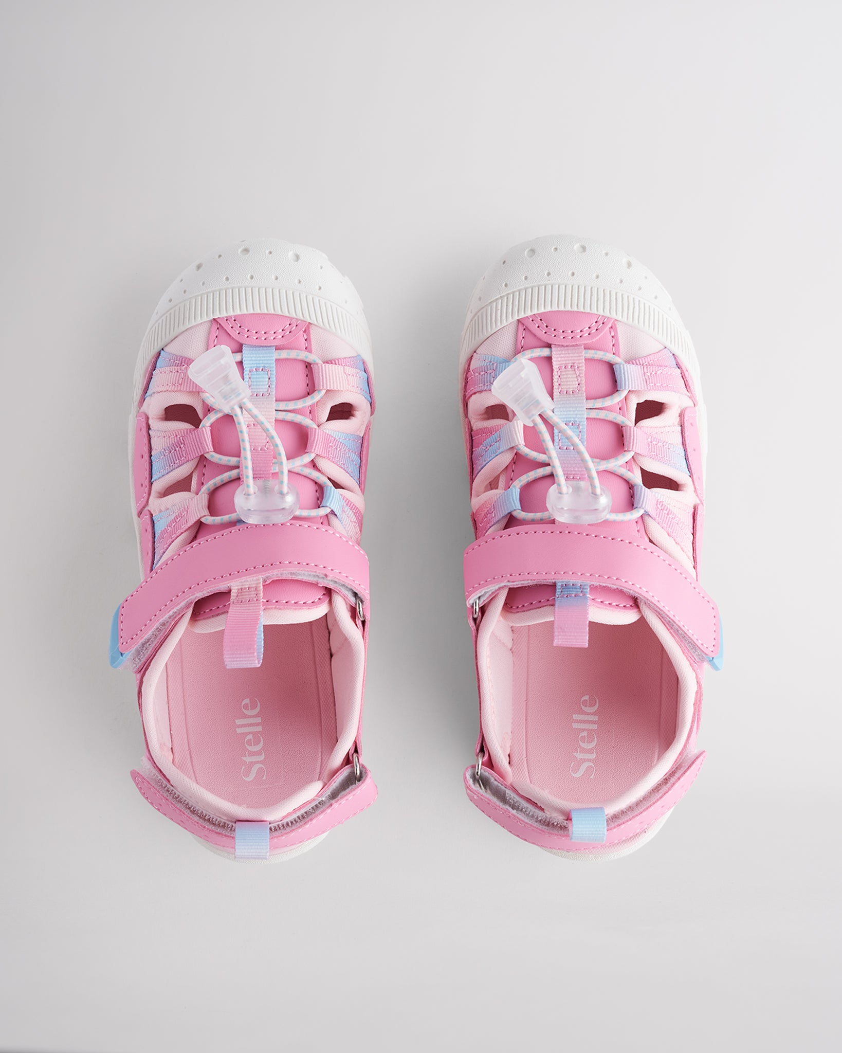Top view of kids sandals with cord lace system and adjustable hook-and-loop straps for secure fit