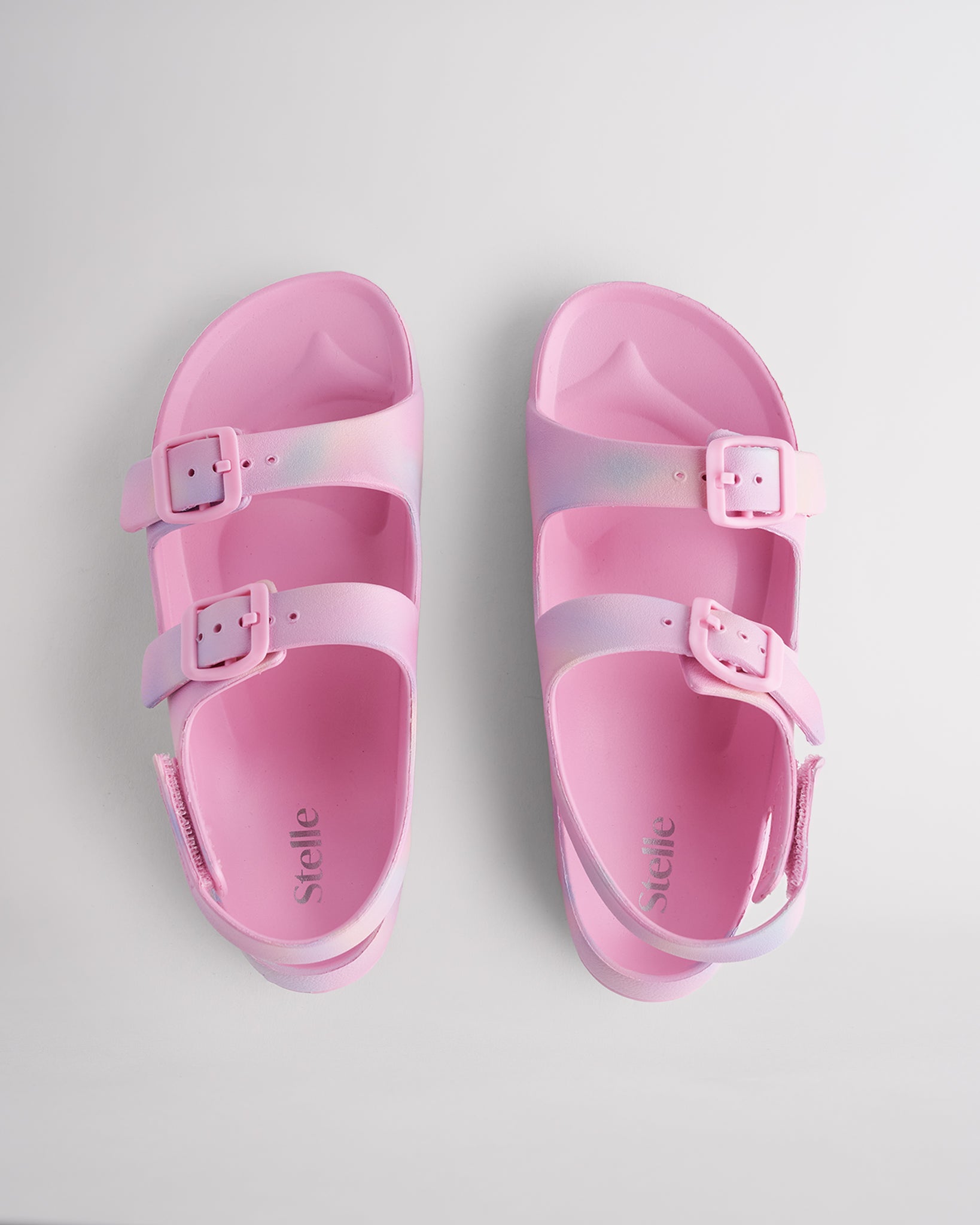 Top view of Cotton Candy Ombre kids sandals with dual adjustable buckles, contoured footbed, and soft lightweight material