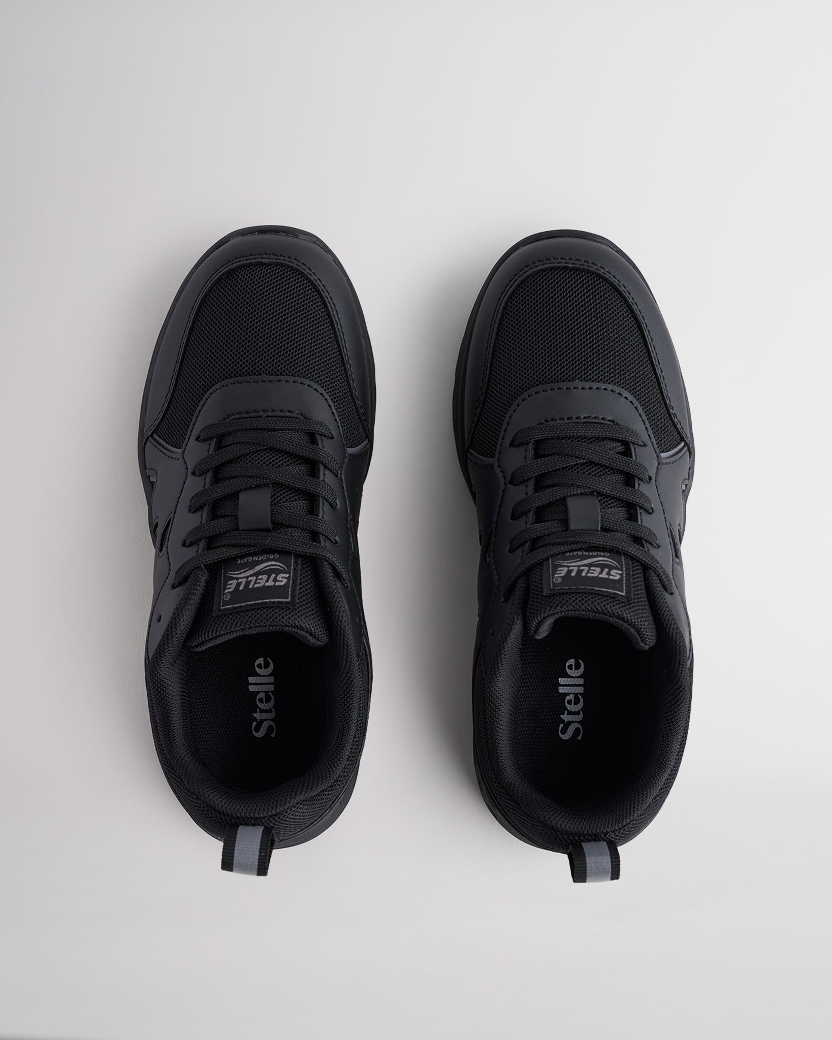 Ninja Black lightweight kids’ sneakers with breathable mesh uppers, a cushioned insole, and a durable outsole.