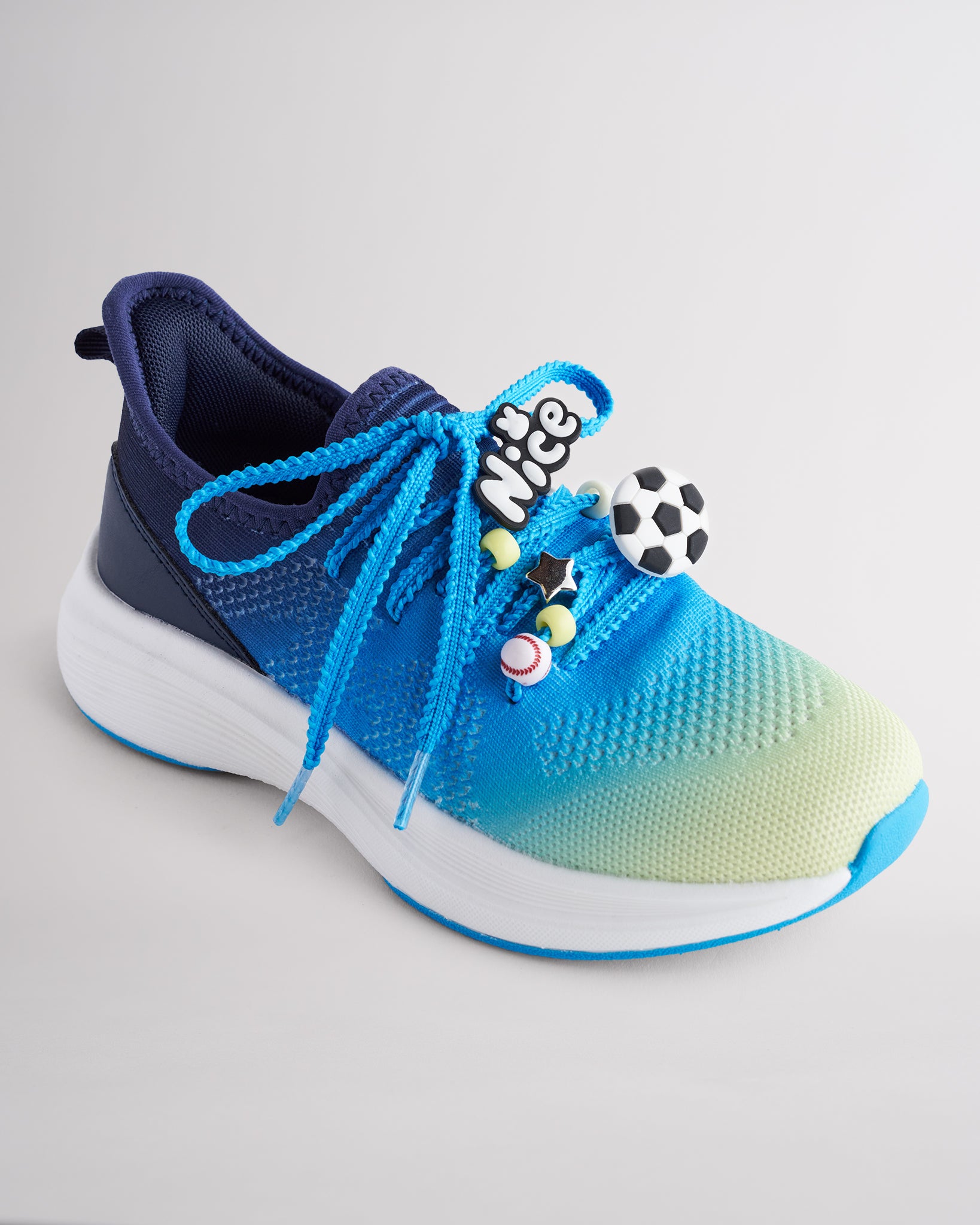Kids Lume Lagoon lace-up running sneakers with colorful sport-themed lace charms.