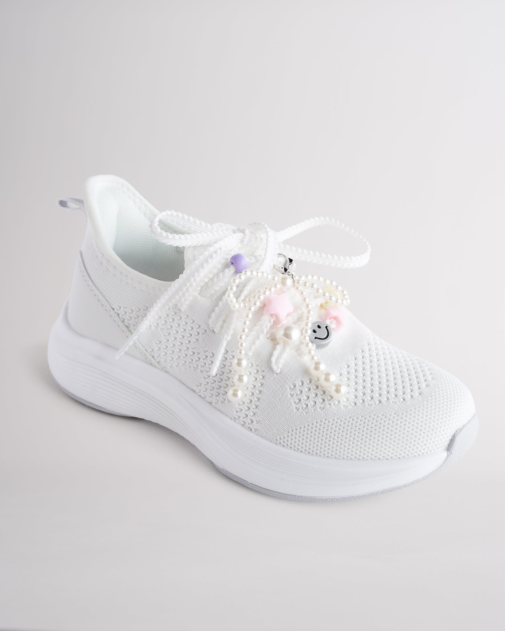 Kids White lace-up running sneakers with with colorful lace charms