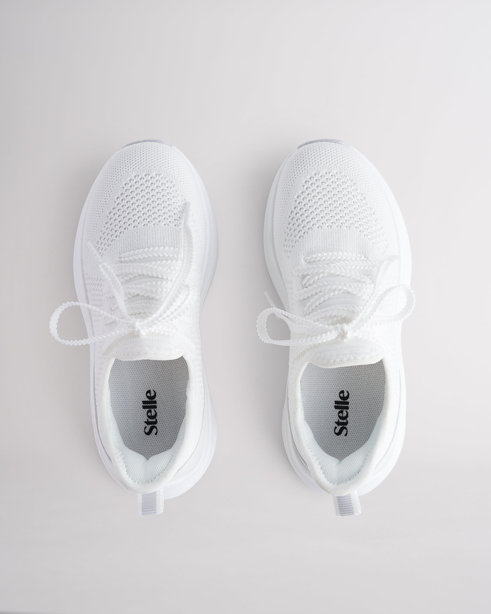 Kids White lace-up running sneakers with cushioned white sole