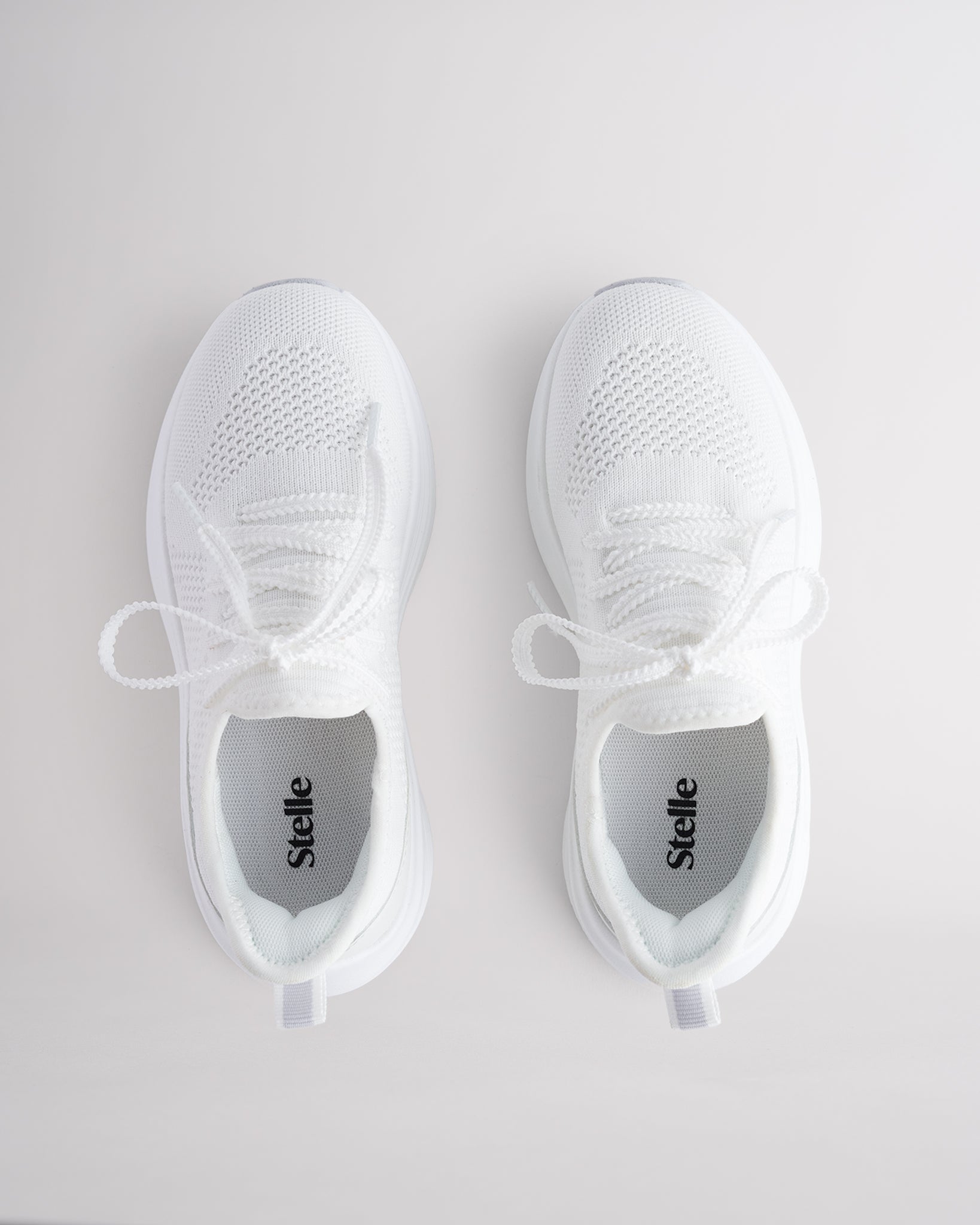 Kids White lace-up running sneakers with cushioned white sole