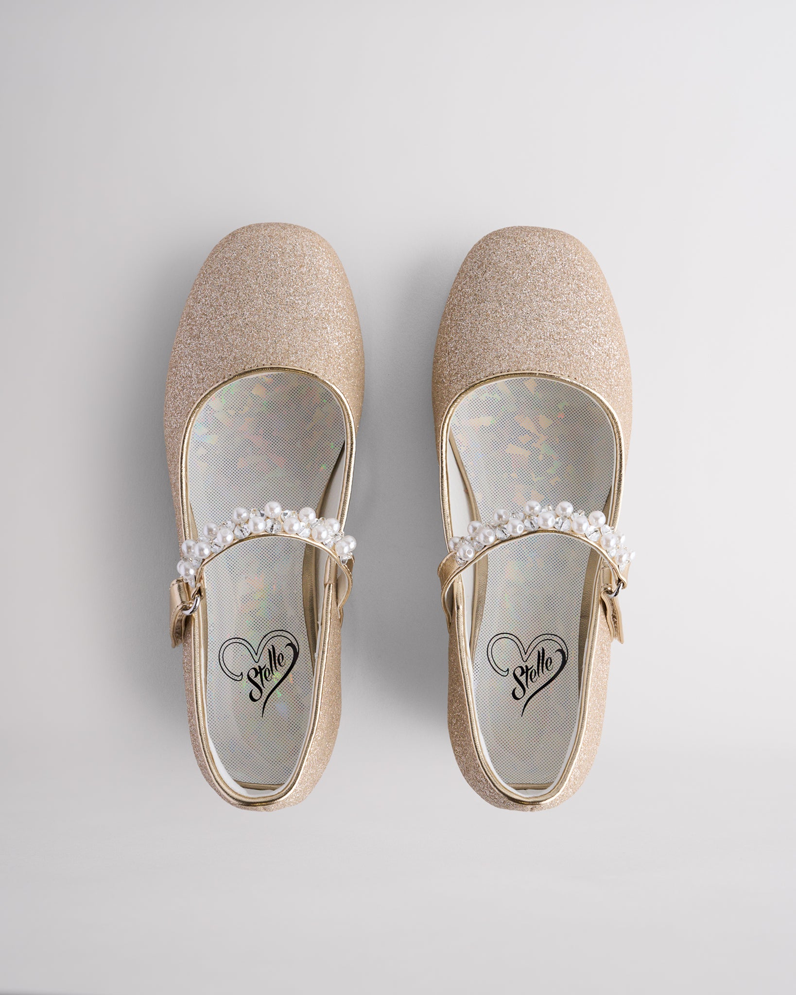 Top view of girls mary jane shoes showing pearl strap and cushioned insole