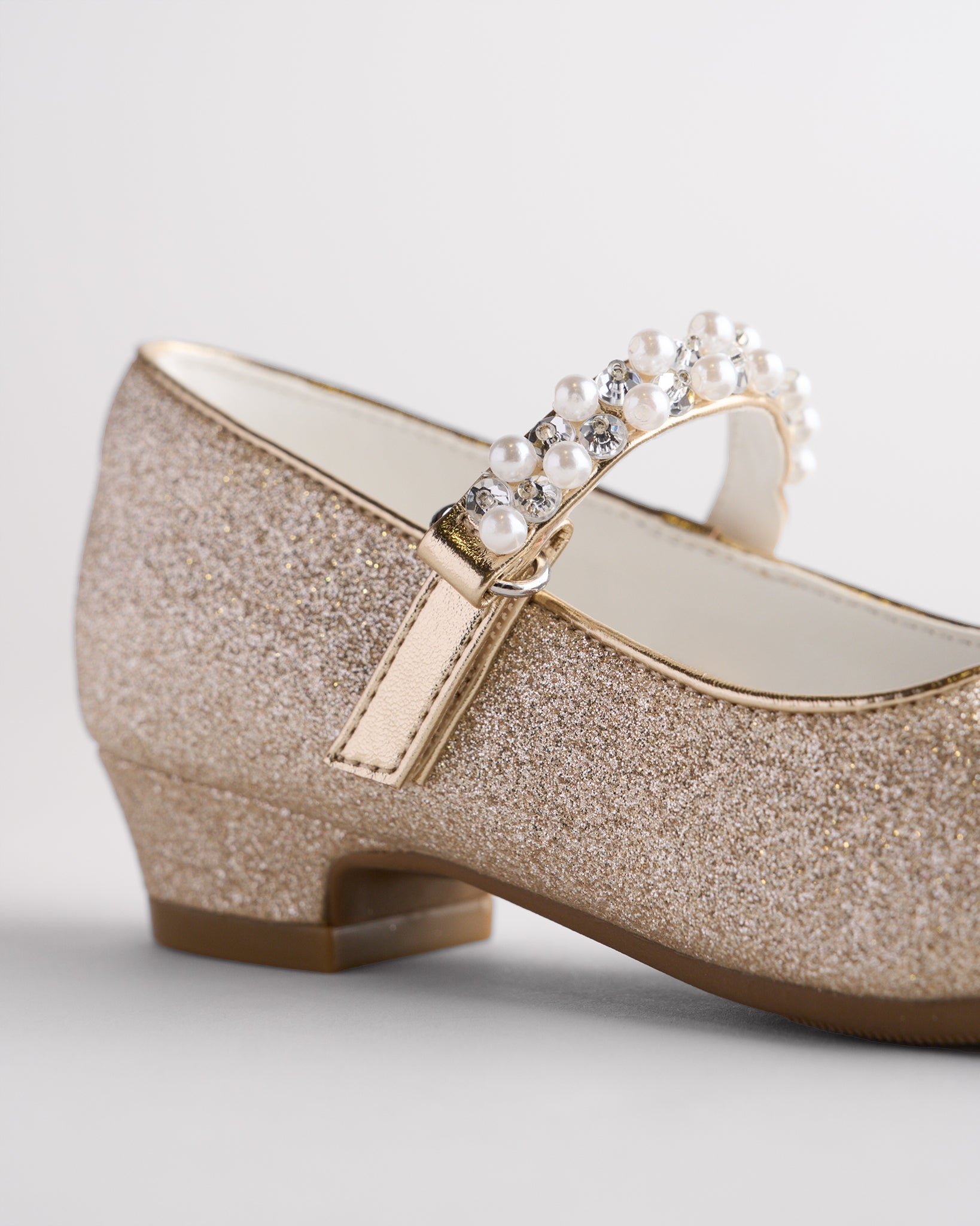 Close-up of girls mary jane shoes featuring anti-slip sole and low heel for stability