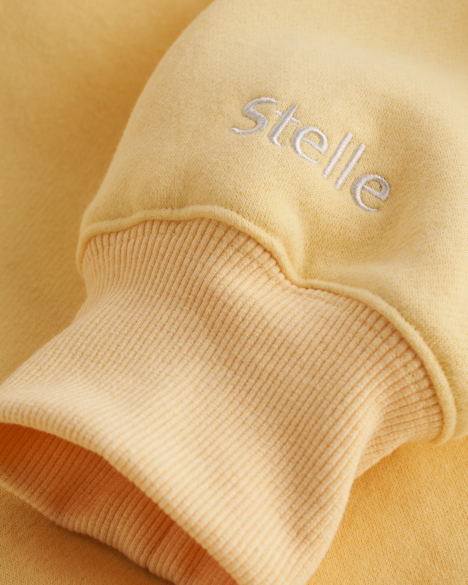 Womens Oversized Fleece Hoodie with Embroidered Cuff in Butter