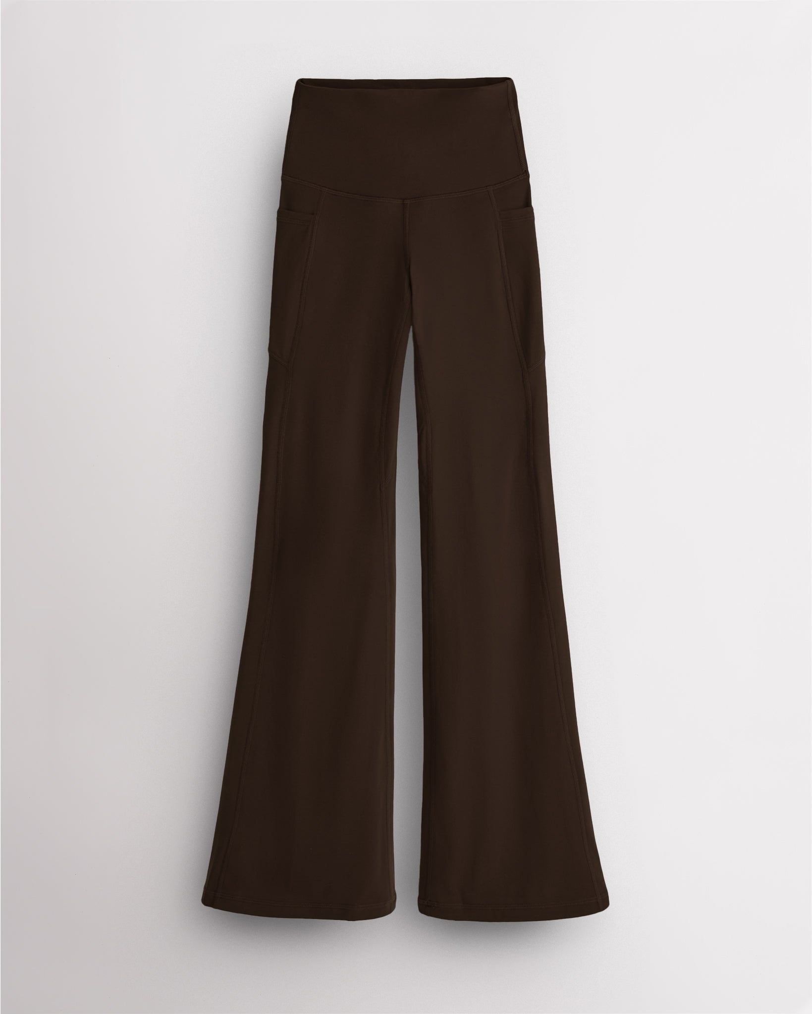 Dark Oak Stelle womens flare leggings with pockets, high waistband, and flared leg design on white background