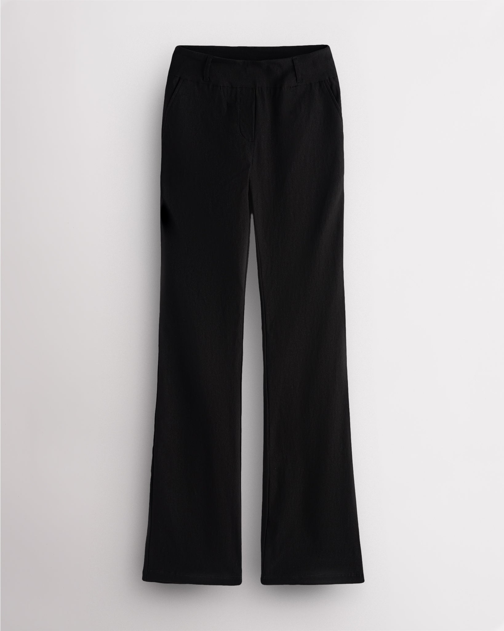 Black Stelle mid-rise bootcut womens work pants with pull-on waistband, faux fly, front pockets, and leg-lengthening bootcut silhouette.