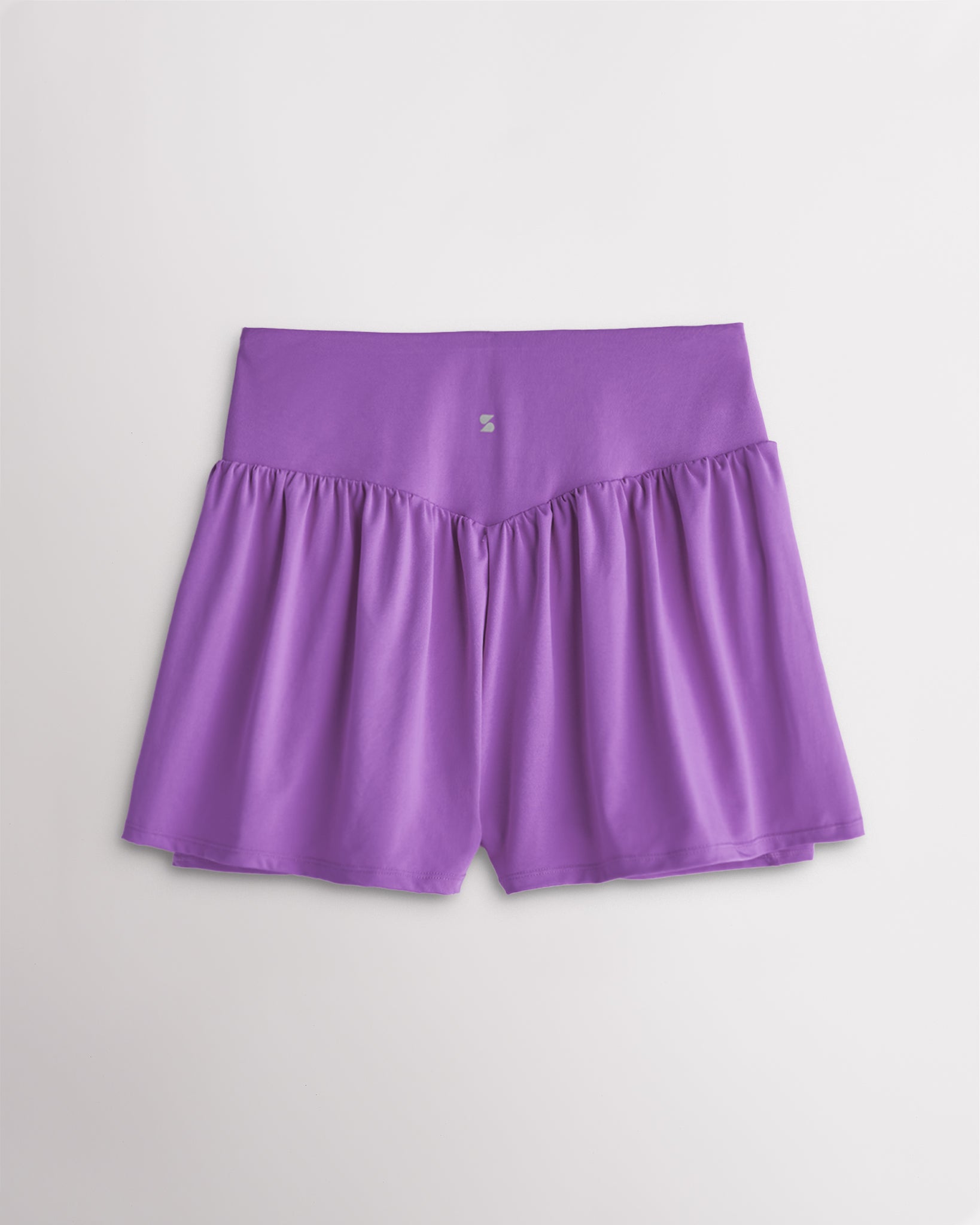 Back view of women’s lavender high waisted athletic shorts with a flowy layered design and V-contour back seam.