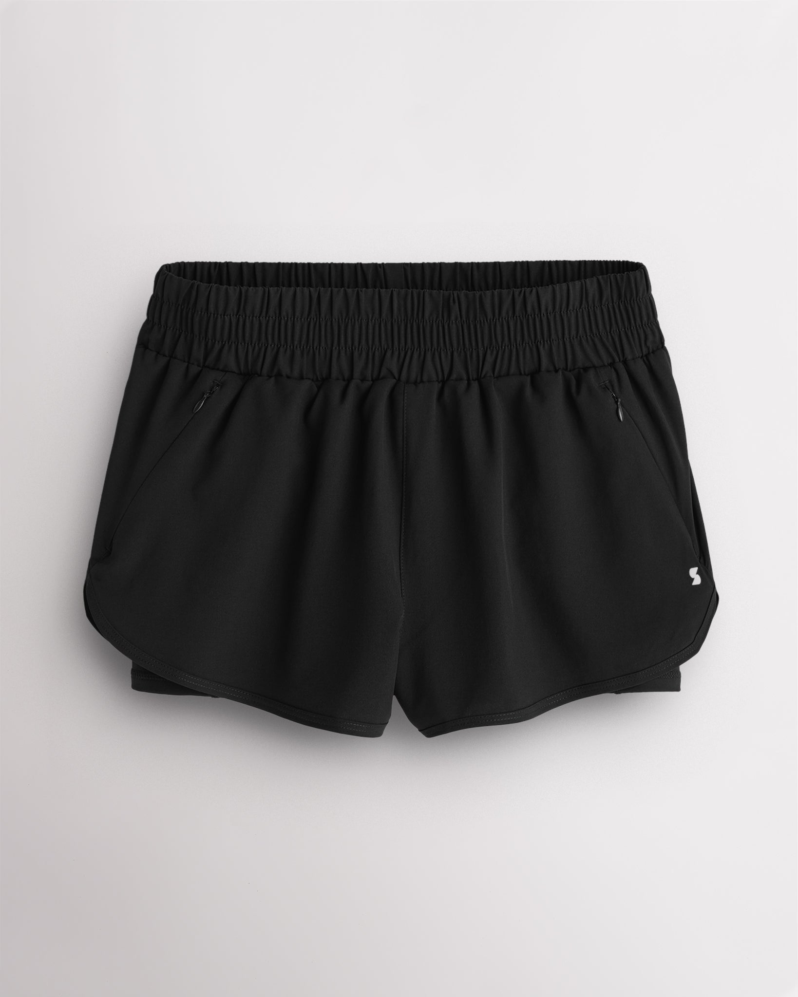 Grey Stelle RushMode 2-in-1 running shorts with wide elastic waistband, zipper pockets, inner shorts lining, and curved dolphin hem.