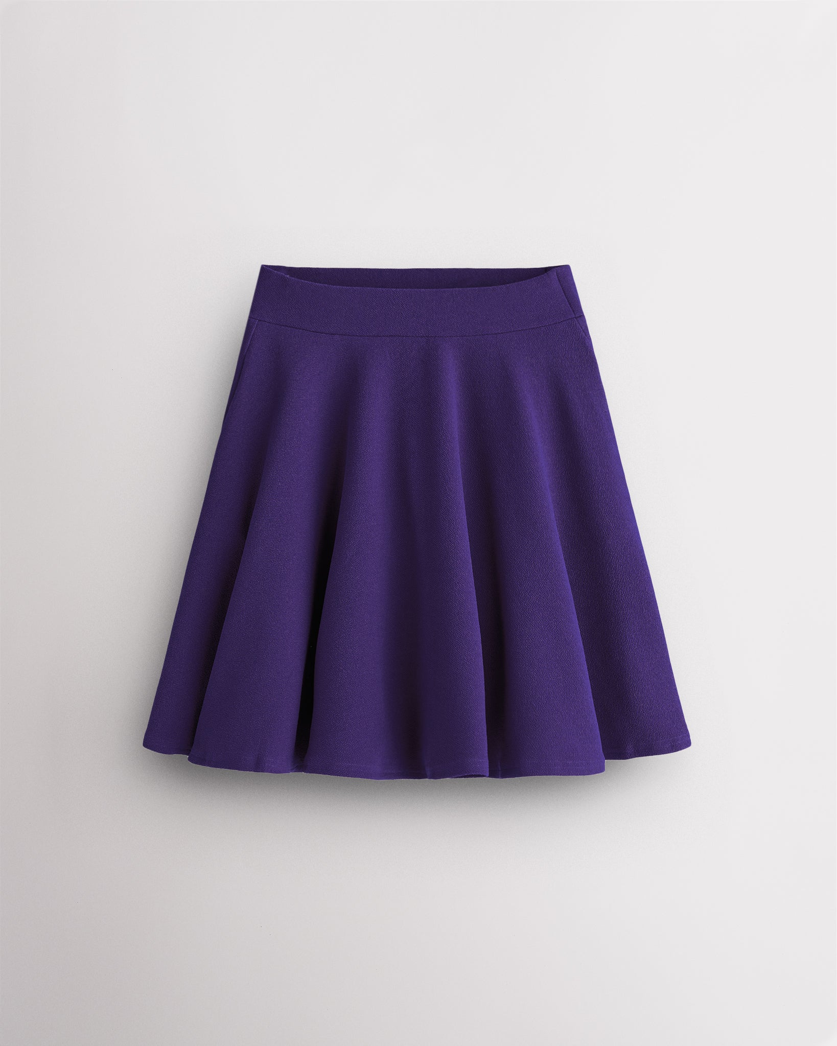 Purple Stelle womens knee-length flared midi skirt with high waistband, A-line silhouette, and flowy pleated design.