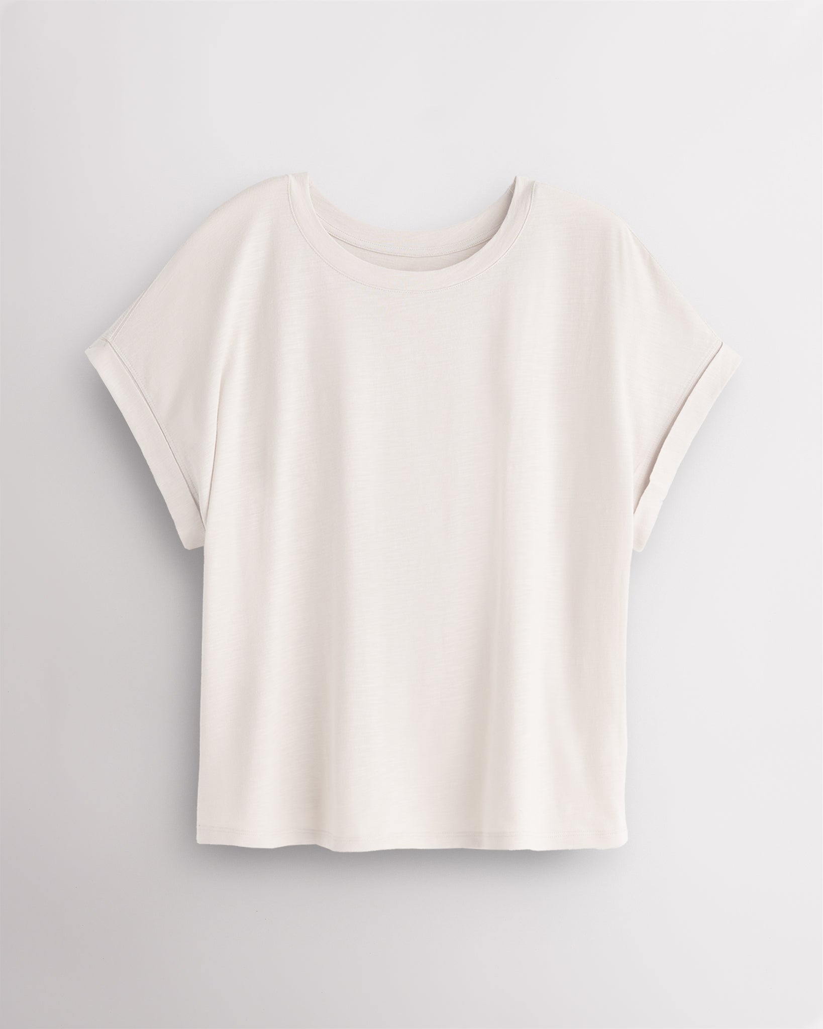 Women’s oversized short sleeve t-shirt in off white with relaxed fit and rolled cuffs