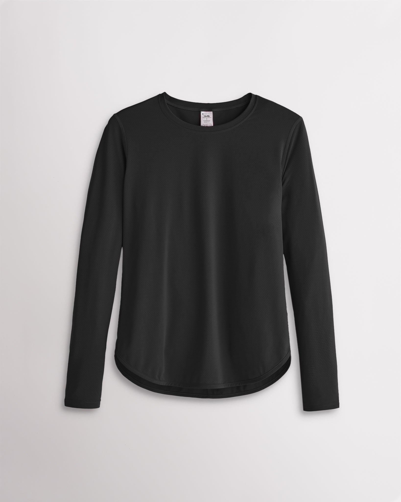 Women’s black UPF 50+ long sleeve sun protection shirt with curved hem and lightweight breathable fabric.