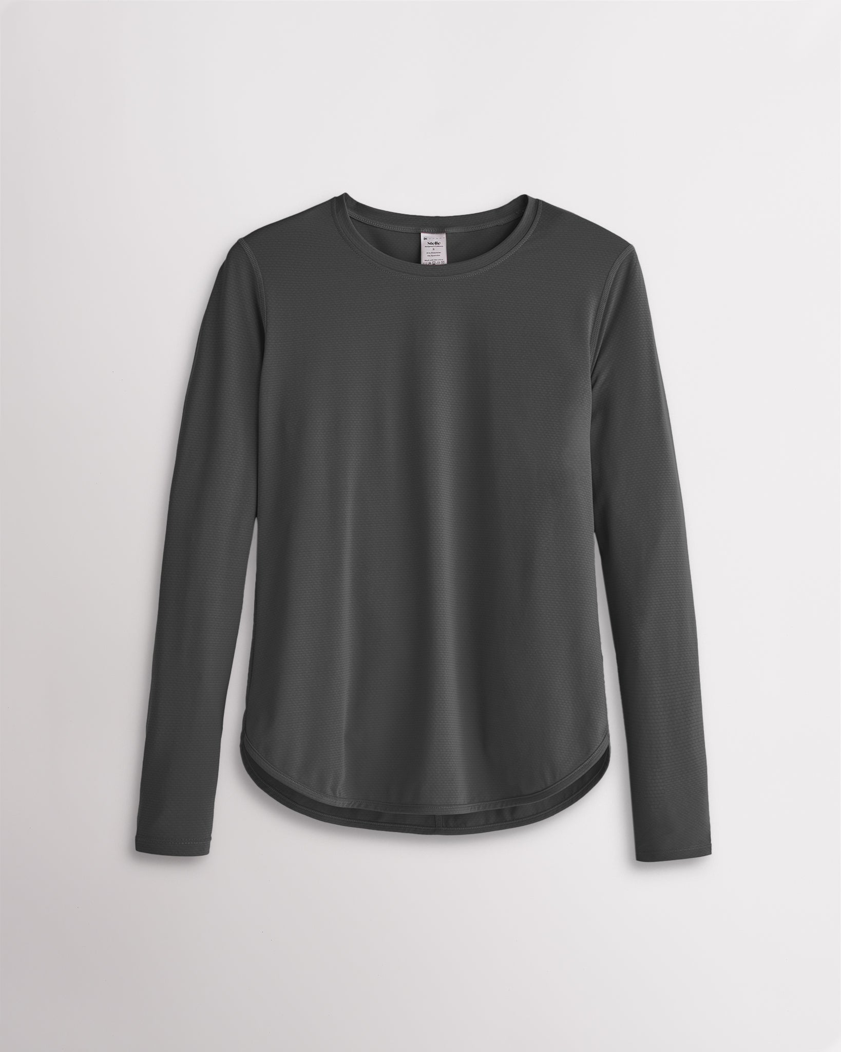 Women’s dark grey UPF 50+ long sleeve sun protection shirt with curved hem and lightweight breathable fabric.