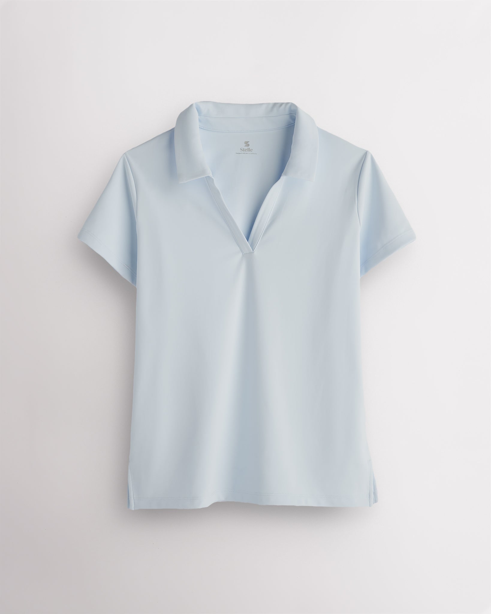 Light Blue womens V-neck athletic polo shirt with classic collar, slim fit and side slit hem for active wear