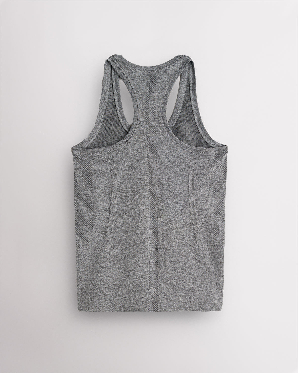 Back view of the grey Stelle seamless tank top, laid flat to show the racerback straps.