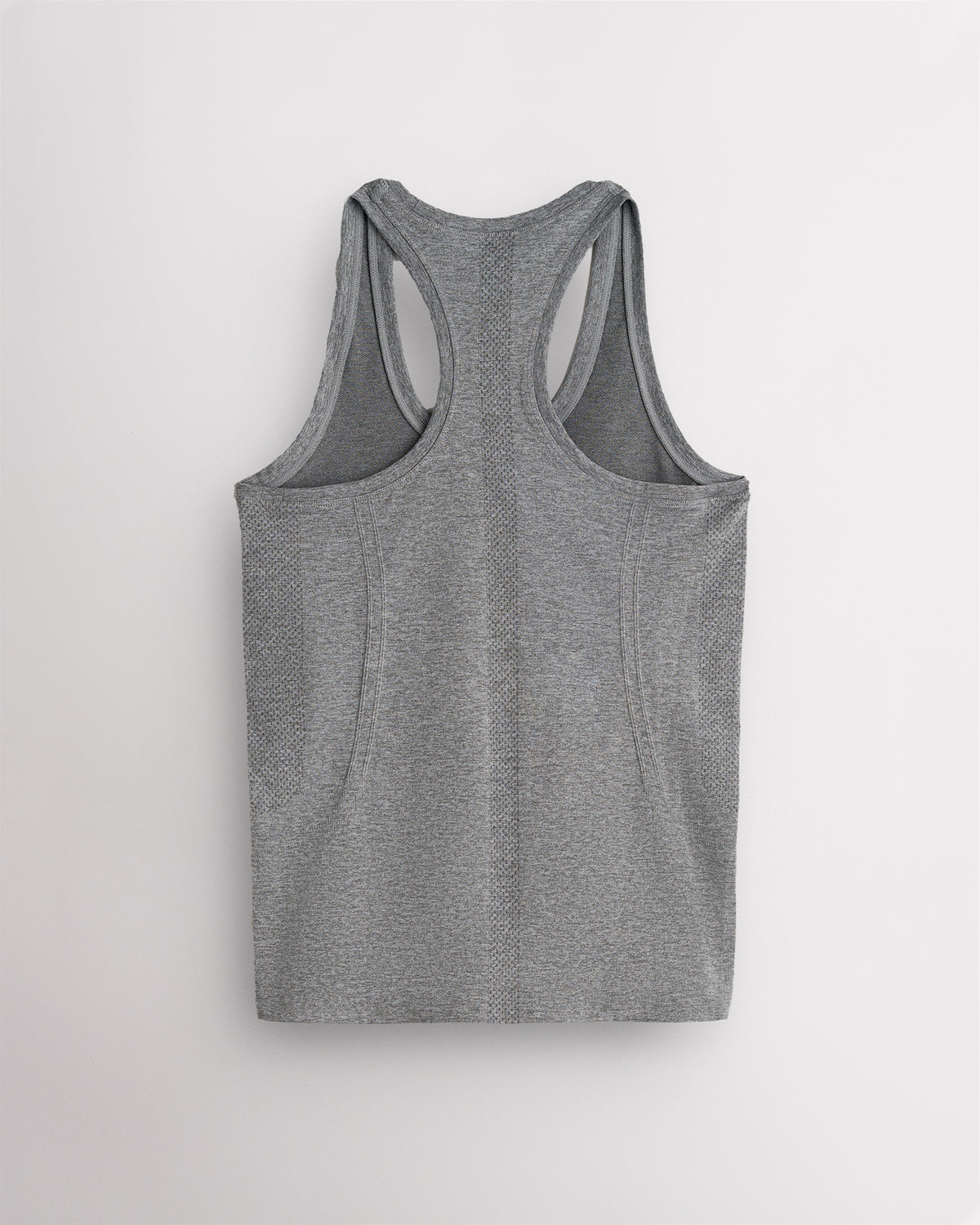 Back view of the grey Stelle seamless tank top, laid flat to show the racerback straps.